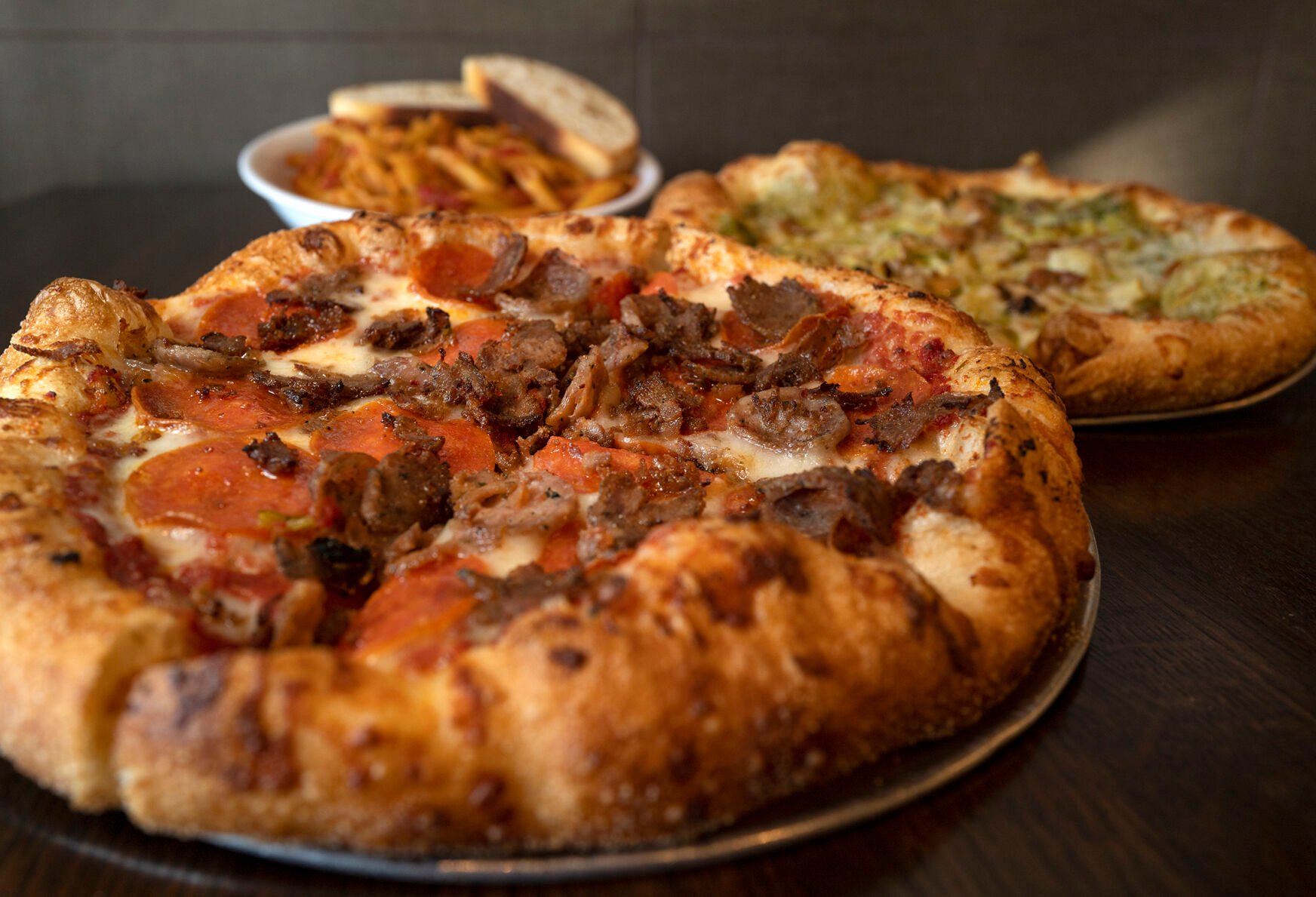 Mici Italian Restaurant (Located at: 3707 Bloomington St.) “Molto Carne Pizza with Cristofori Pizza and Cortonese Pasta” Monday December 119, 2022. Photo by Jeff Kearney. (Jeff Kearney)