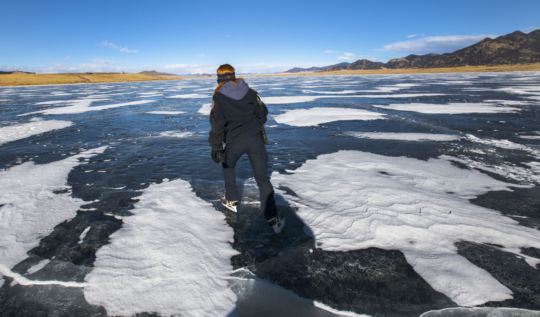 Park ranger Kelli Lewis wears her old pair of hockey skates while working at Eleven Mile Reservor (Christian Murdock, The Gazette)
