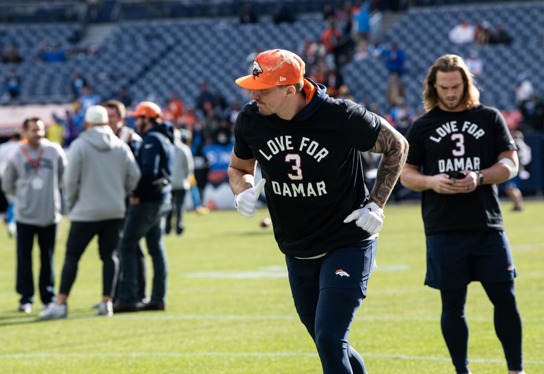 Denver Broncos and Los Angeles Chargers players warmed up in shirts in support of Bills player Damar Harris before the last regular season game Sunday, Jan. 8, 2023 at Empower Field at Mile High in Denver. (Parker Seibold, The Gazette) (Parker Seibold)