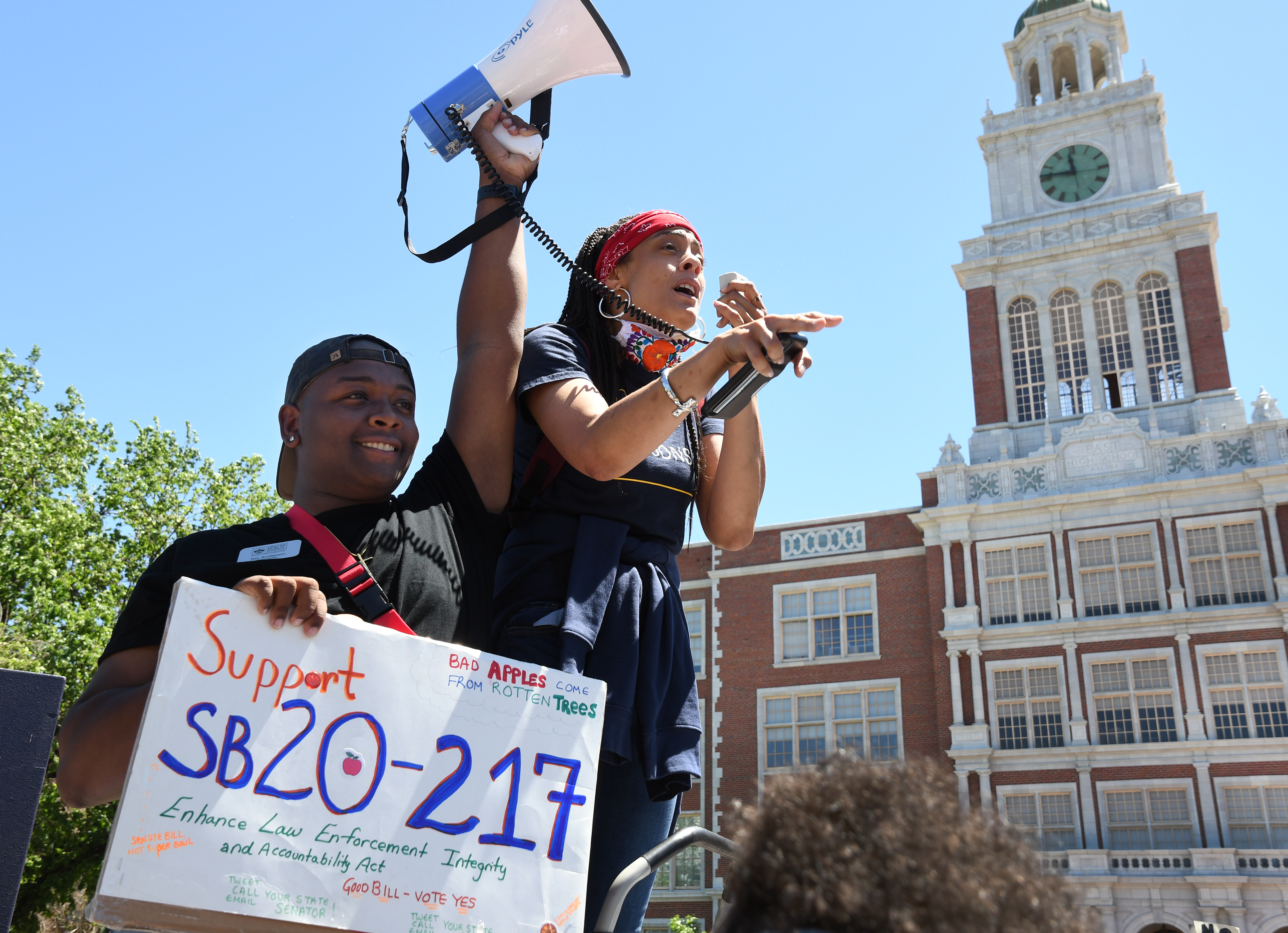 Denver School Board member Tay Anderson, left, and Elisabeth Epps from the Colorado Freedom Fund stop in front of East High School and address their support for Senate Bill 20-217 that is before the Colorado Legislature. The two joined Denver Public Schools students as they gather at Civic Center Park and march to the Martin Luther King, Jr. statue at City park in support of Black Lives Matter on June 7, 2020 in Denver, Colorado. (Kathryn Scott, special to Colorado Politics)