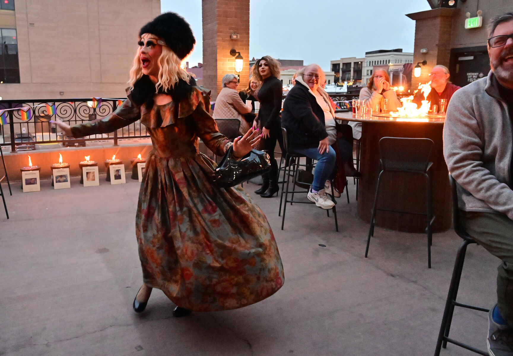 “Potted Plant” entertains the crowd attending a fundraiser for Club Q victims at Phantom Canyon Brewing Company on Sunday. “Potted Plant” was one of the drag show entertainers to perform at the fundraiser. In the background is a memorial to the five who were killed during the shooting at the club. (Jerilee Bennett, The Denver Gazette)