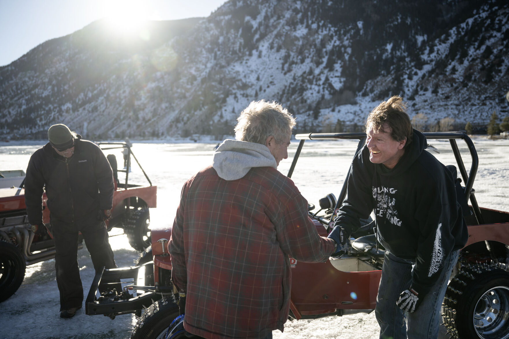Men’s Competition Cheaters race winner Lee Bashline, left, and second place driver Mark Lannerd shakes hands after a close final race during the first day of the Our Gang 4 Wheelers ice racing club’s 2023 racing season on Saturday, Jan. 7, 2023, in Georgetown, Colo. The Cheater division is named for the tires used, which have 1 1/2 inch sharpened bolts protruding from them. (Timothy Hurst/The Denver Gazette) (TimHursttim.hurst@gazette.comhttps://secure.gravatar.com/avatar/aca82bd62b4ee425c598527cd6faa1b1?d=mm&r=g)