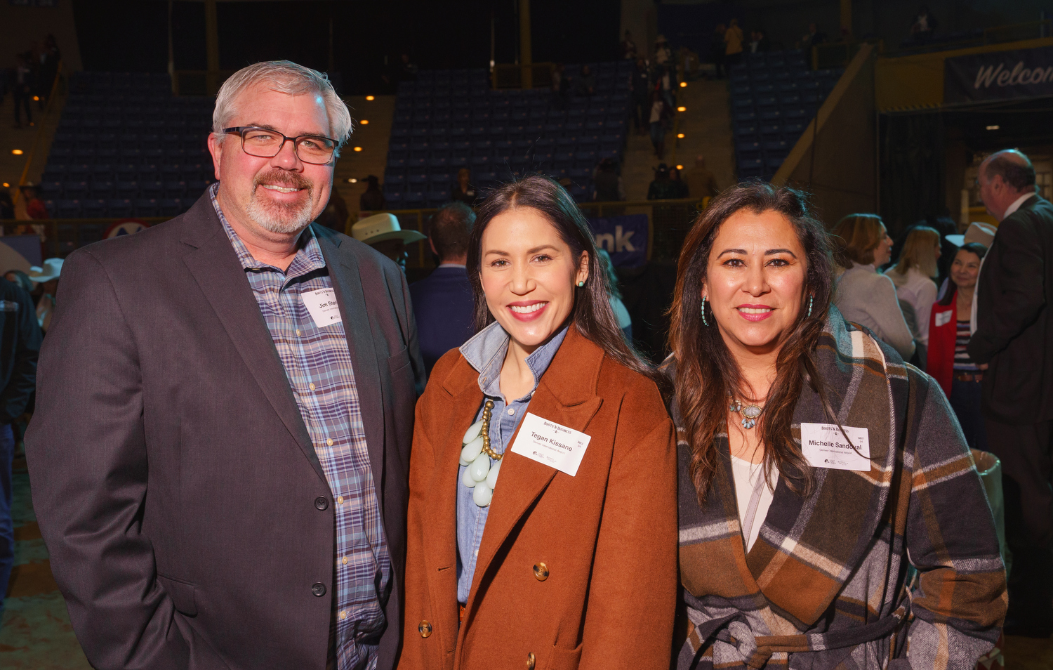 Representing Denver International Airport, left to right: Jim Starling, executive vice president; Tegan Kissane, senior director of business management services; and Michelle Sandoval, assistant director of the Commerce Hub. Boots ’n Business event, hosted by the Denver Metro Chamber of Commerce, at the National Western Events Center in Denver, Colorado, on Friday, Jan. 6, 2023. Photo StevePeterson.photo (STEVE PETERSON/SPECIAL TO COLORADO POLITICS)