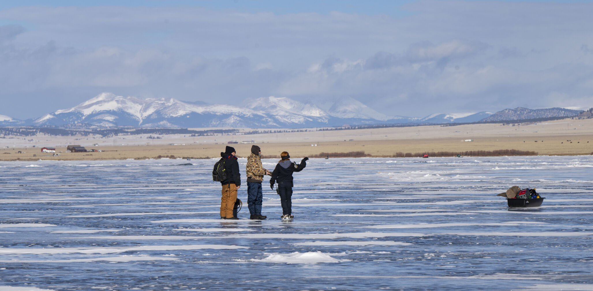 Lewis talks to anglers about the ice fishing conditions Jan. 6 while patrolling. (Christian Murdock, The Gazette)