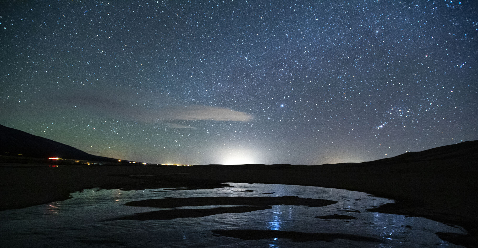 The night sky reflects on Medano Creek in the Great Sand Dunes National Park in Mosca. The national park achieved International Dark-Sky status in 2019, one of only 130 or so such places in the world. (Christian Murdock, The denver Gazette)