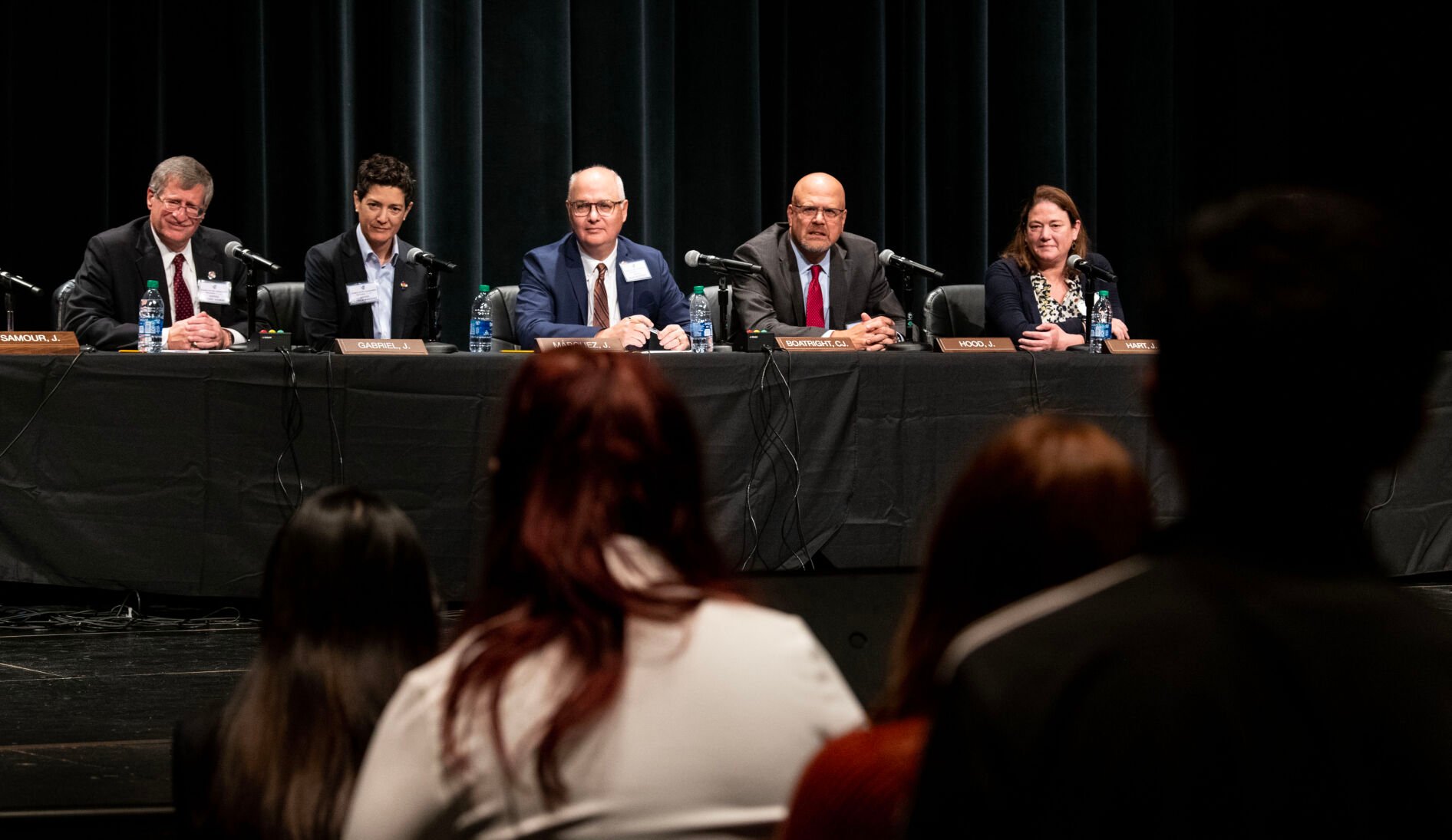 FILE PHOTO: Students from Pine Creek High School ask the justices of the Colorado Supreme Court questions after watching them hear arguments from two cases in the high school auditorium on Nov, 17, 2022. Pictured from left to right are Justice Richard L. Gabriel, Justice Monica M. Márquez, Chief Justice Brian D. Boatright, Justice William W. Hood III and Justice Melissa Hart. (Parker Seibold/The Gazette)
