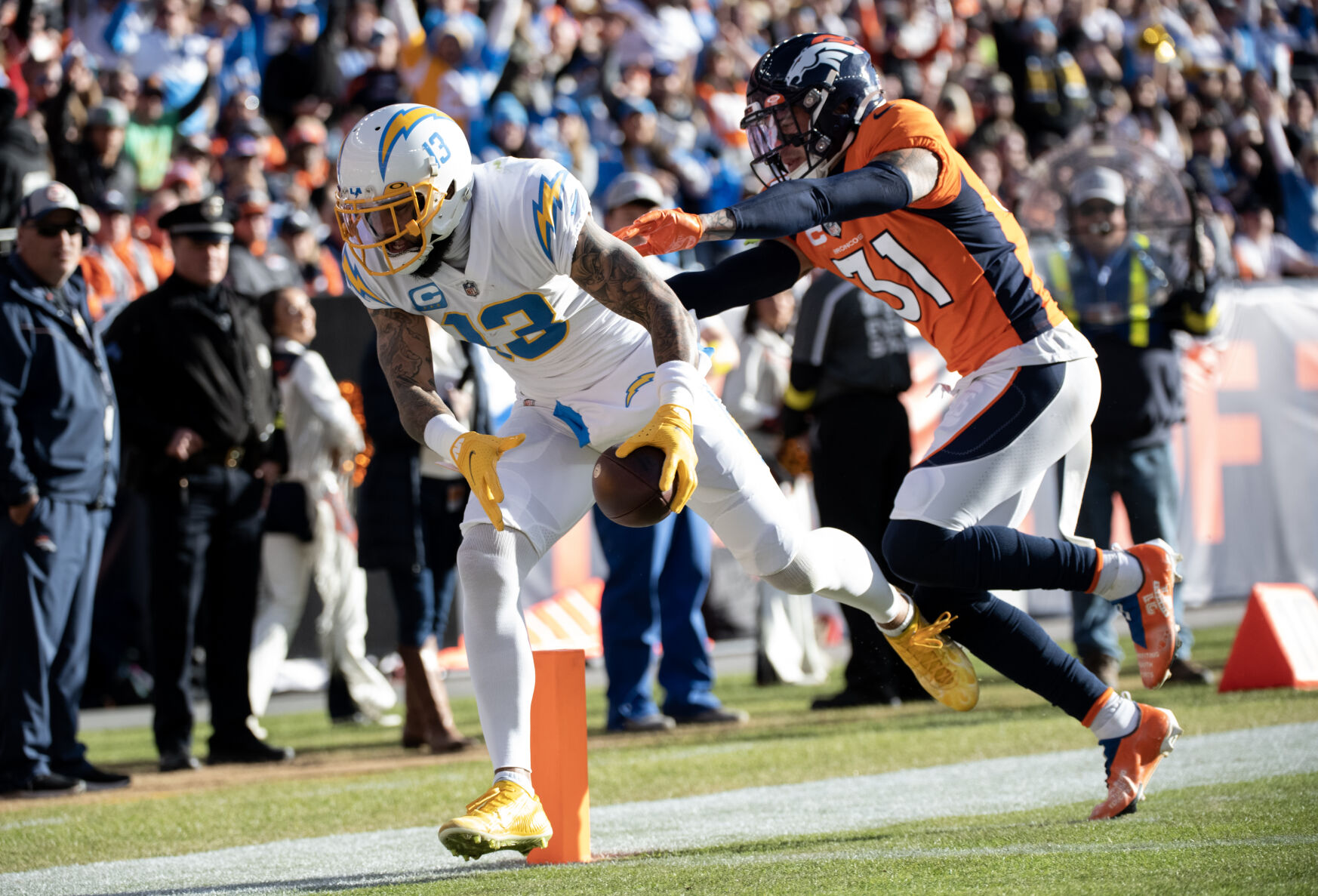 Denver Broncos safety Justin Simmons (31) pushes Los Angeles Chargers wide receiver Keenan Allen (13) the goal line as he runs in a touchdown during the the first half of the last regular season game Sunday, Jan. 8, 2023 at Empower Field at Mile High in Denver. (Parker Seibold, The Gazette) (Parker Seibold)
