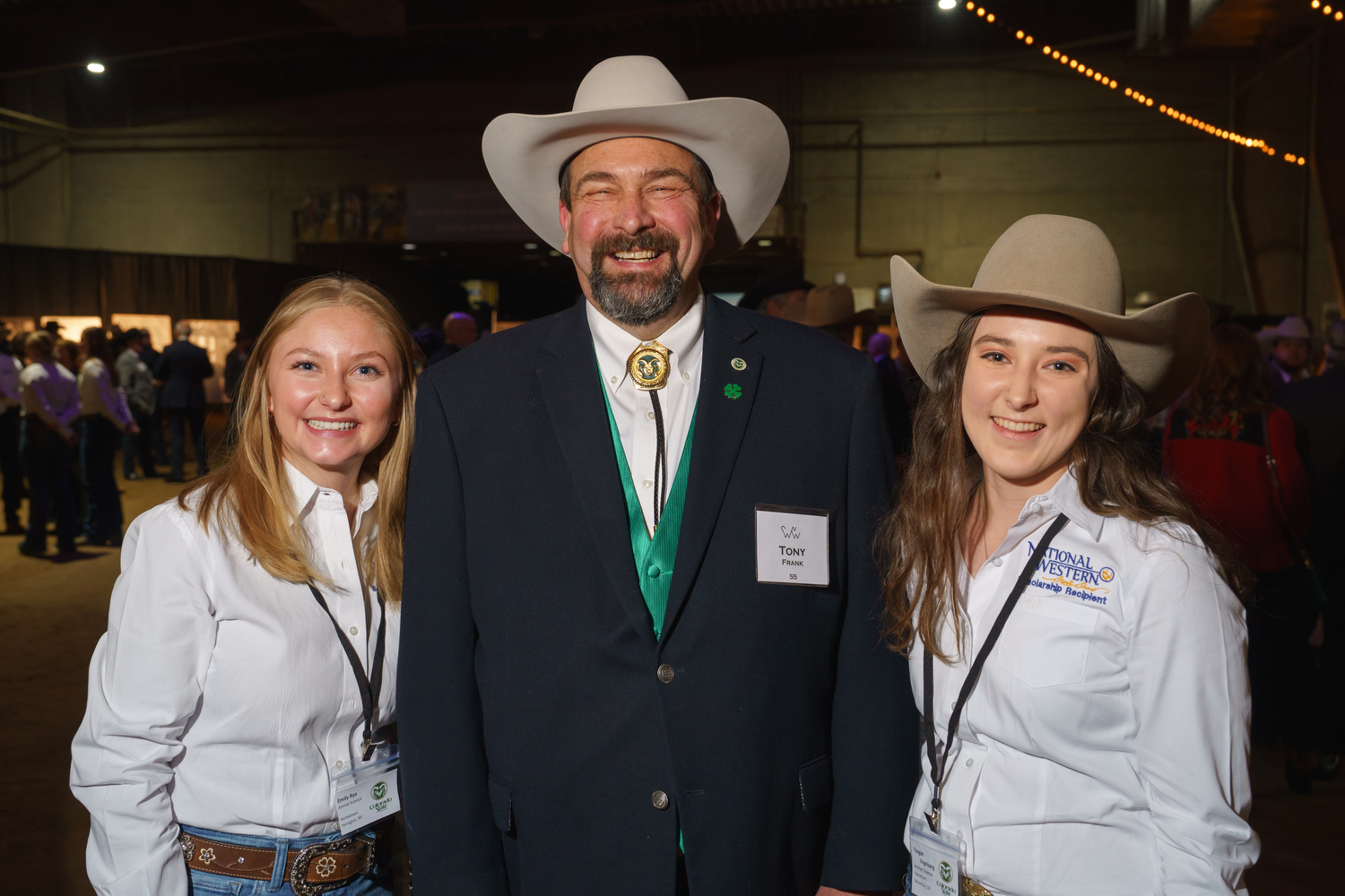 Dr. Tony Frank, Chancellor of the CSU System, center, with National Western Scholarship recipients Emily Rye, left, and Teagan Vogelsang, both in the Animal Science program at CSU. The National Western Stock Show 2023 Citizen of the West award dinner at the National Western Events Center in Denver, Colorado, on Monday, Jan. 9, 2023. Photo StevePeterson.photo (STEVE PETERSON/SPECIAL TO THE DENVER GAZETTE)
