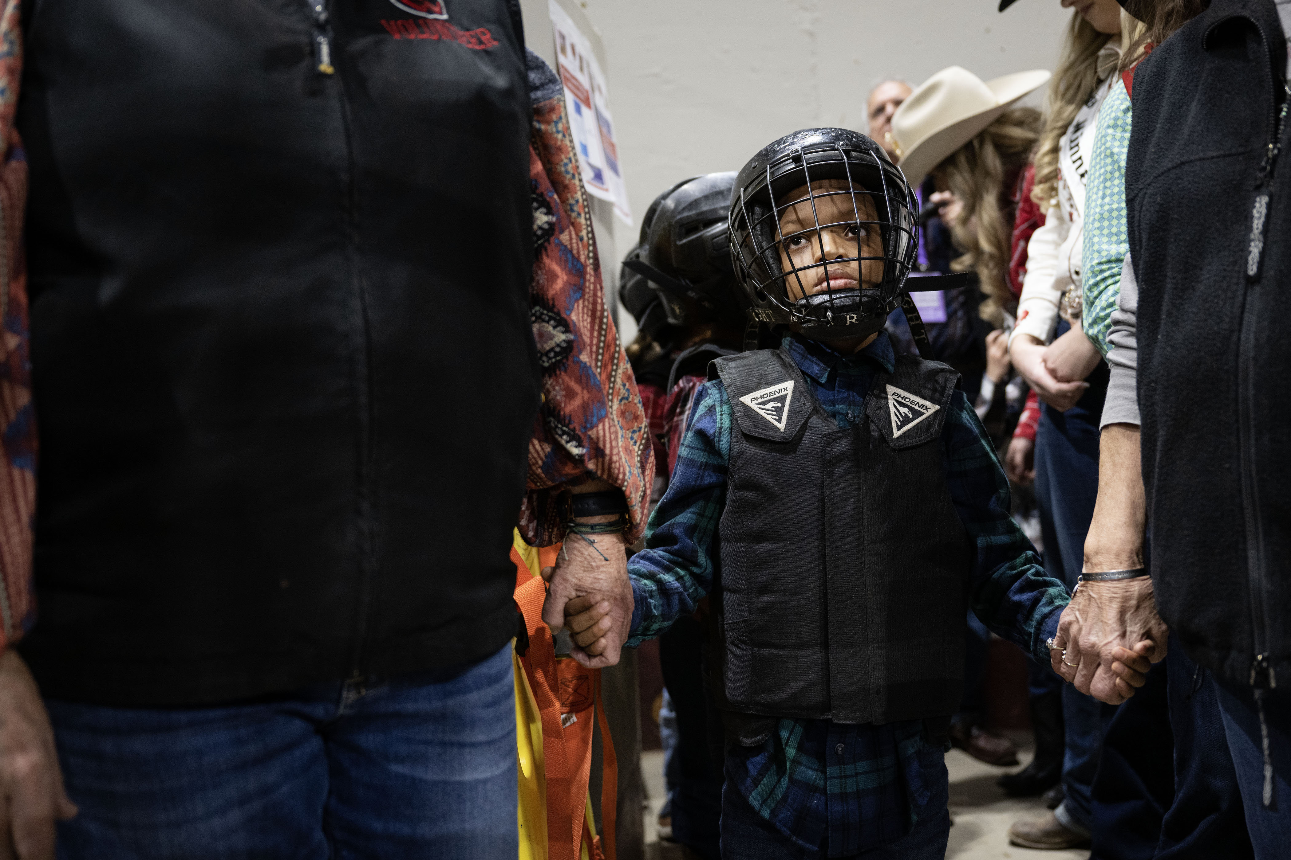 Mutton Austin’ competitor Champ Hysaw, 6, holds the hands of two organizers before heading out to the arena during the MLK Jr. African-American Heritage Rodeo on Monday, Jan. 16, 2023, at the Denver Coliseum in Denver, Colo.(Timothy Hurst/The Denver Gazette) (TimHursttim.hurst@gazette.comhttps://secure.gravatar.com/avatar/aca82bd62b4ee425c598527cd6faa1b1?d=mm&r=g)