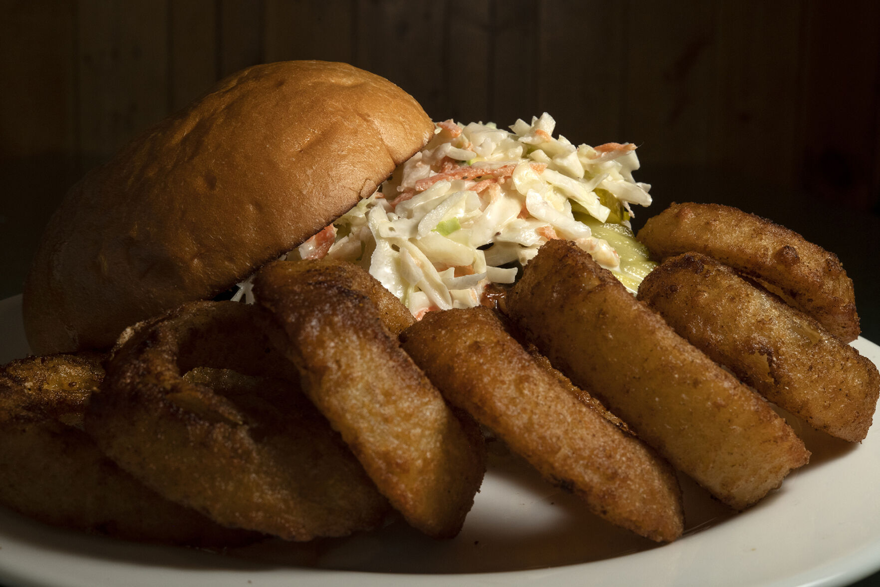 Cherry Cricket Restaurant (Located at: 2641 E. 2nd Ave. Denver, CO.) “Barbecue Pulled Pork Sandwich with Onion Rings” Thursday February 16, 2023. Photo by Jeff Kearney. (Jeff Kearney)