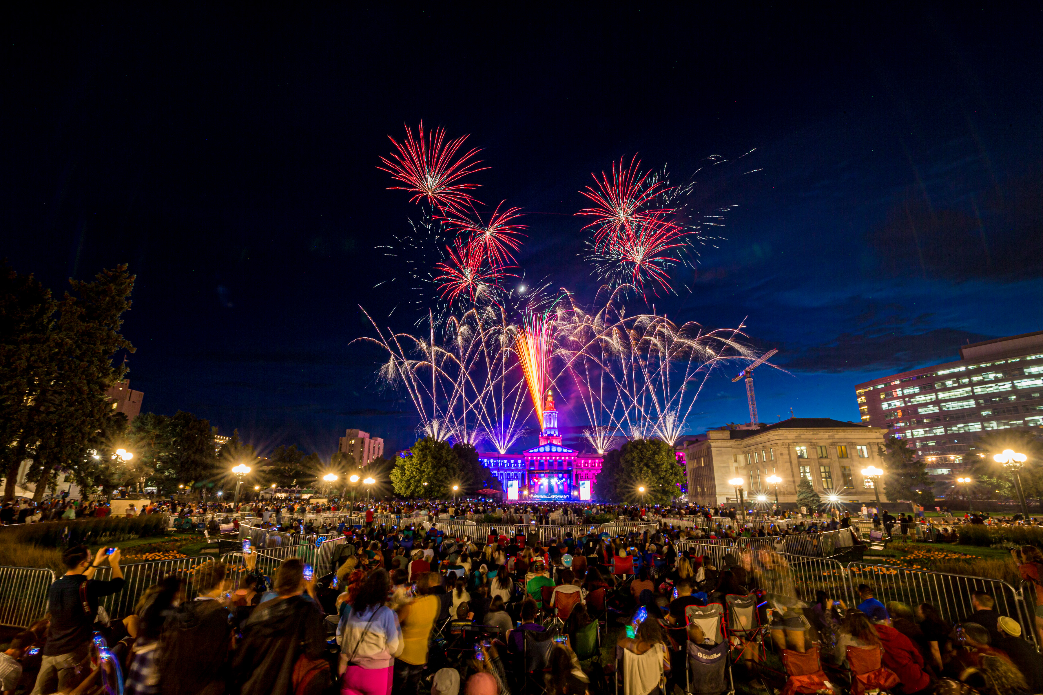 The Colorado Symphony plays as fireworks illuminate the sky in celebration of Independence Day at Civic Center Park in downtown Denver, Colo. on Sunday, Jul. 3, 2022. (Liz Copan/For the Denver Gazette) (Liz Copan/For the Denver Gazette)