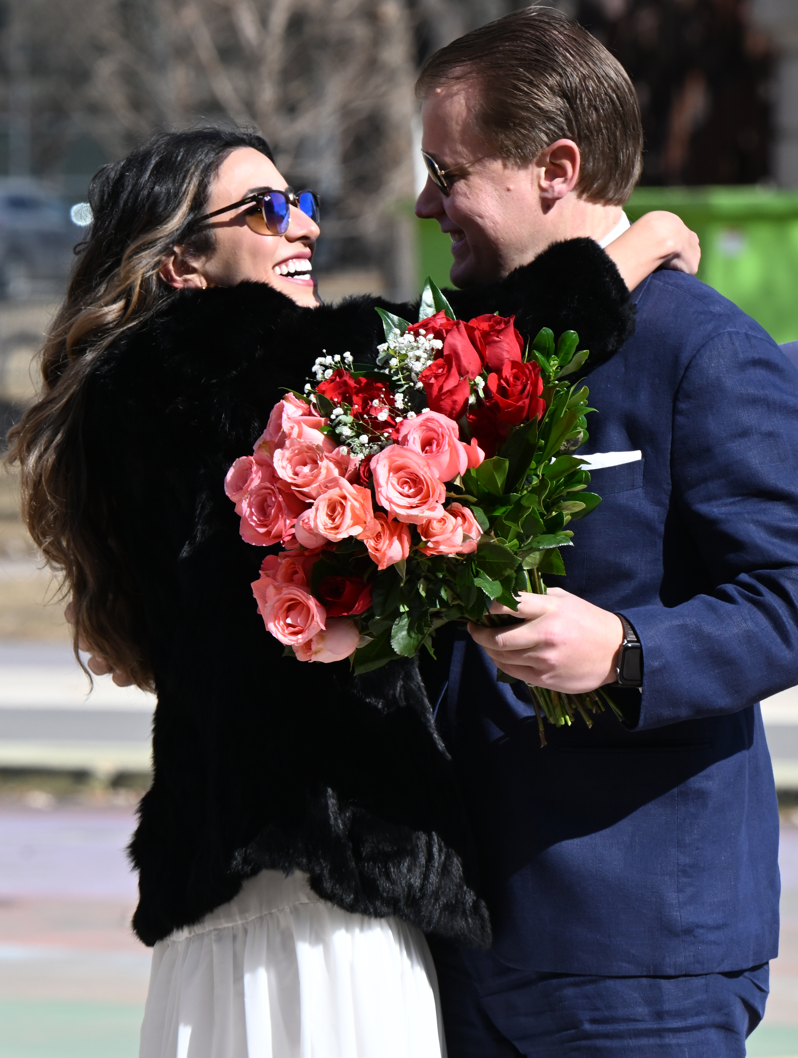 Zain Allison and his bride-to-be Tania Pena-Lfaro hug before their wedding on the front steps of the Denver City and County building Tuesday, Feb. 14, 2023 during the Denver Marriage Marathon on Valentine's Day. Ten couples were married during the event. This year was the first year since 2019 it was held because of the pandemic. The couple met five years ago at the hospital where they both worked. Peno-Lfaro said it was 