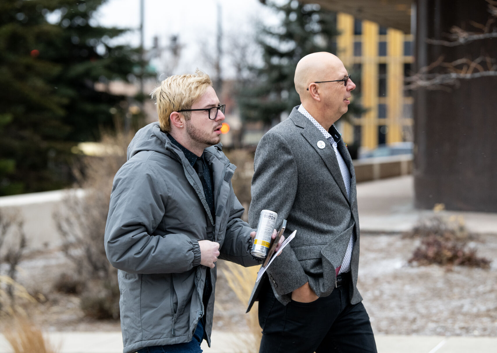 Club Q co-owner Matthew Haynes, right, walks with Michael Anderson, an employee and survivor of the shooting at Club Q, into the El Paso County Courthouse for a preliminary hearing for Anderson Aldrich. (Parker Seibold, The Gazette)