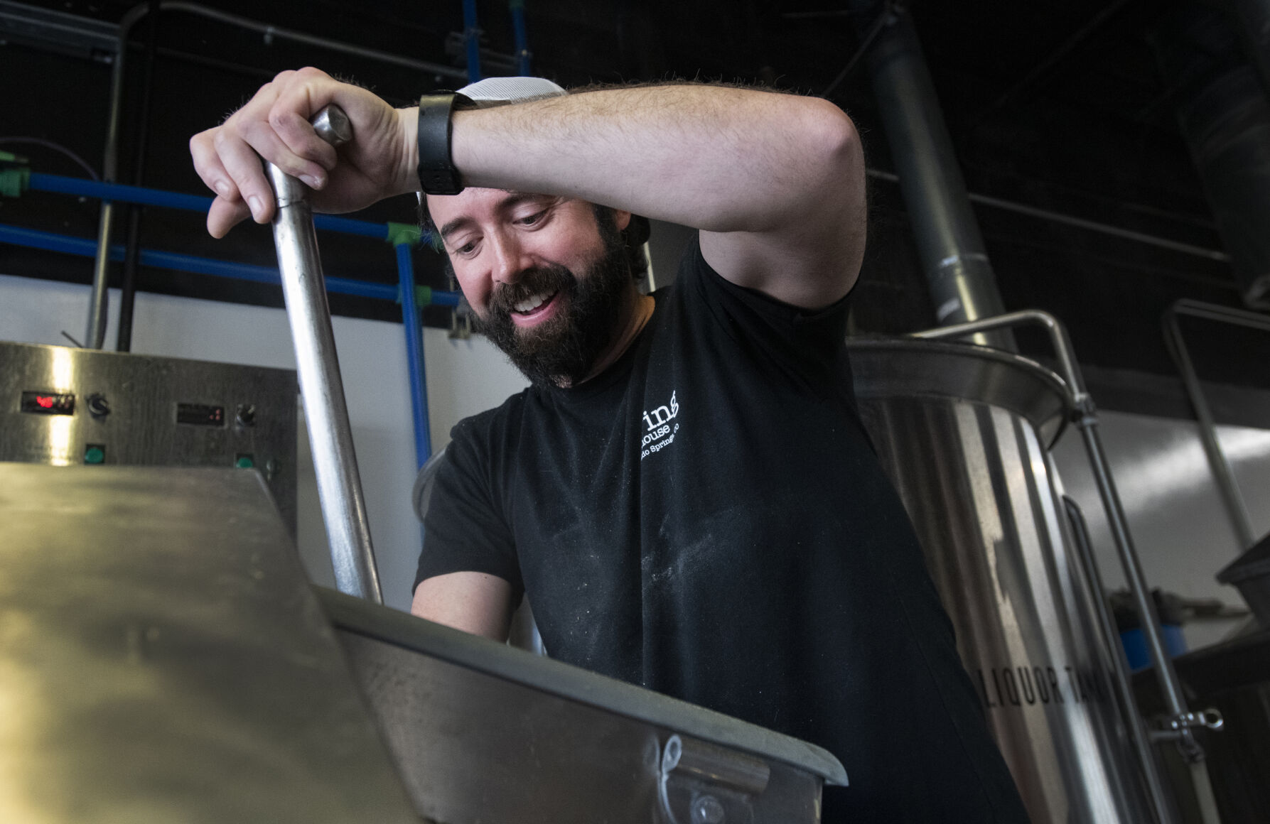 Red Swing Brewhouse brewer Peter Hall stirs the wort Friday, Feb. 10, 2023, as the Colorado Springs brewery and Launch Pad Brewery team up on a beer pairing of a Belgian style beer with lemon peel and green tea for the Colorado Brewer Guild’s Collaboration Fest. (The Gazette, Christian Murdock) (Christian Murdock/The Gazette)