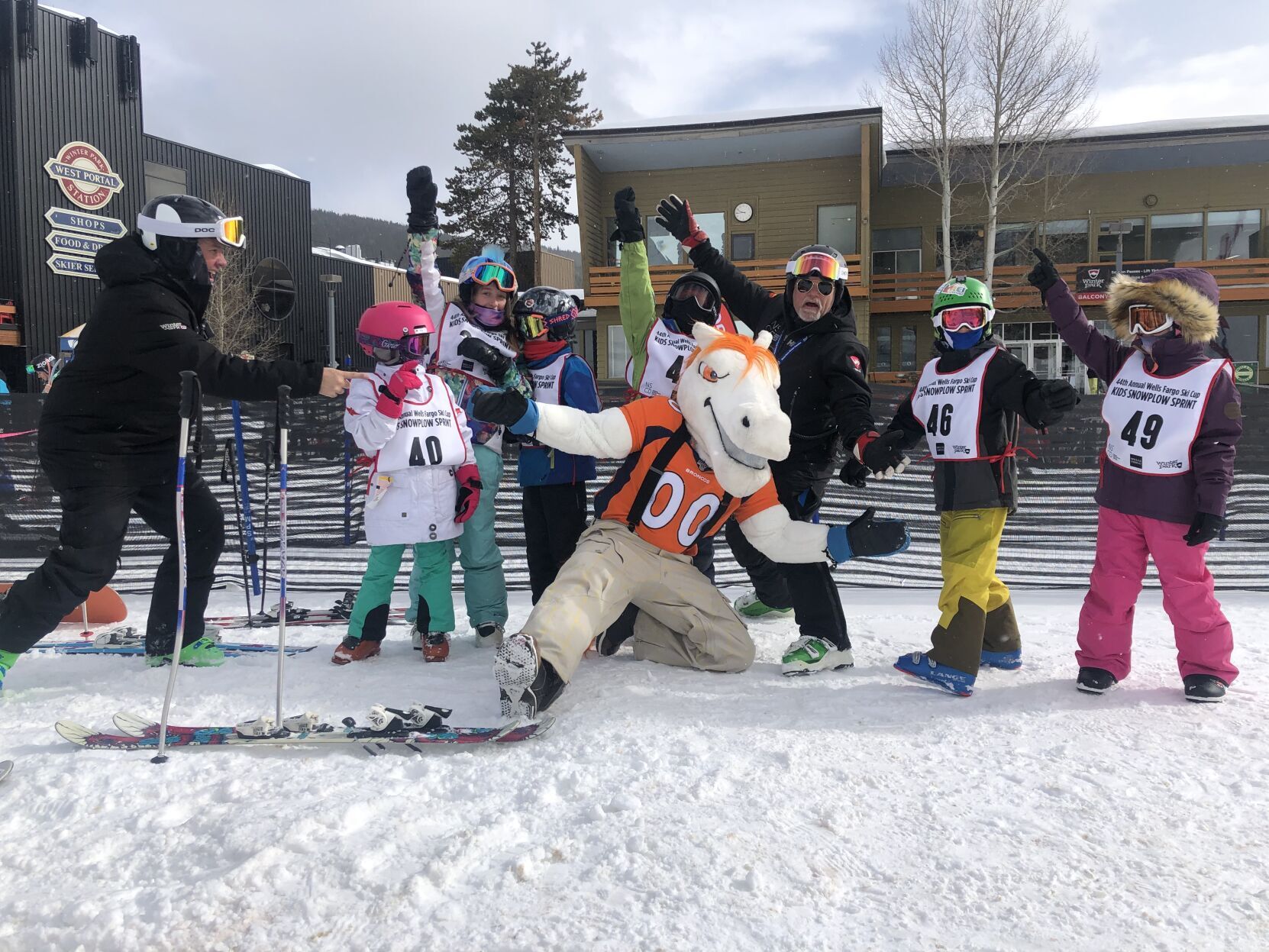 Miles, the Denver Broncos’ mascot, center, takes time to pose for a photo with participants at a previous Wells Fargo Ski Cup. (Photos courtesy of the National Sports Center for the Disabled)