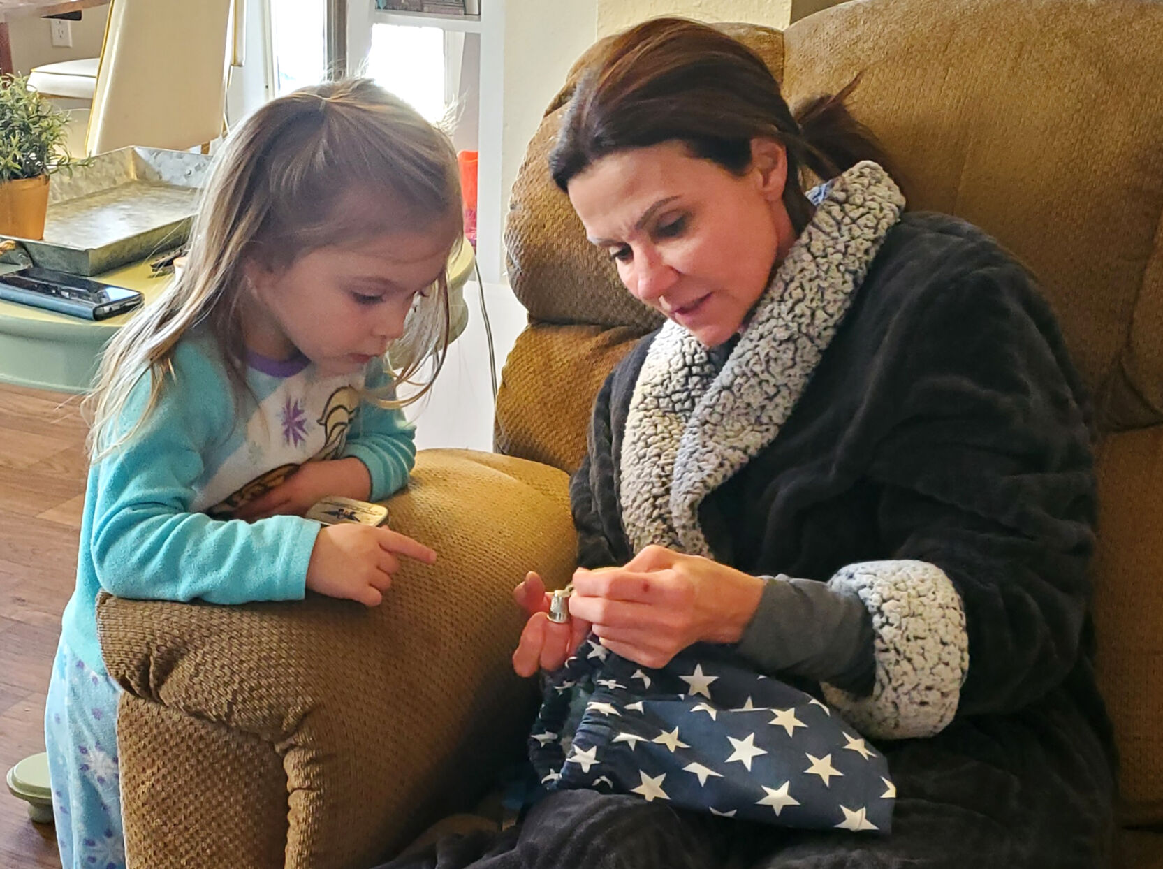 Sophia Berry sewing a Wonder Woman costume with her grandmother. ( Family photo)