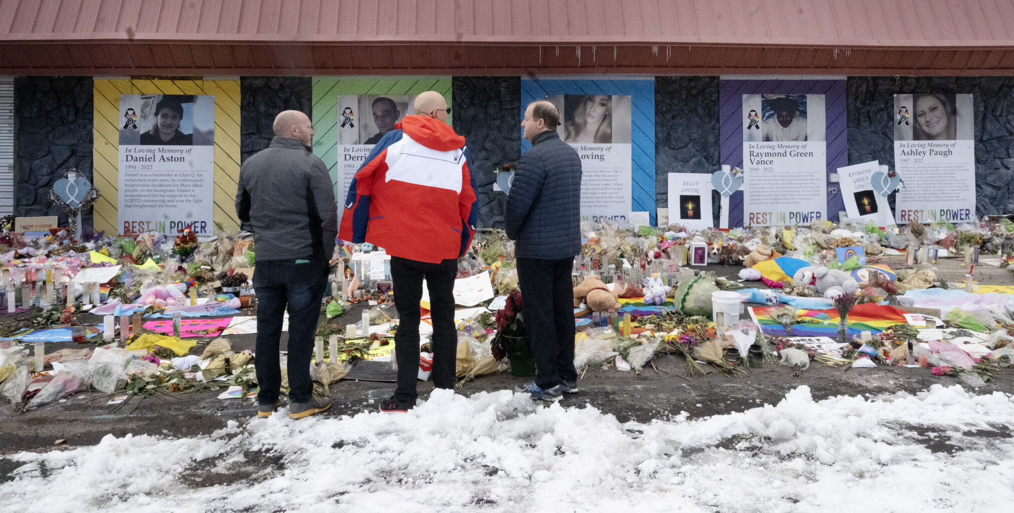 Colorado Gov. Jared Polis (right) is given a tour of the memorial at Club Q by owners Nic Grzecka and Matthew Haynes (left to right) Hundreds of heartfelt items have been left in support of victims and families that were impacted by last week’s mass shooting at Club Q. The governor visited the memorial at Club Q with the two owners and afterwards answered a few questions from the press on Tuesday, Nov. 29, 2022. (Photo by Jerilee Bennett, The Gazette) (JERILEE BENNETT/THE GAZETTE)