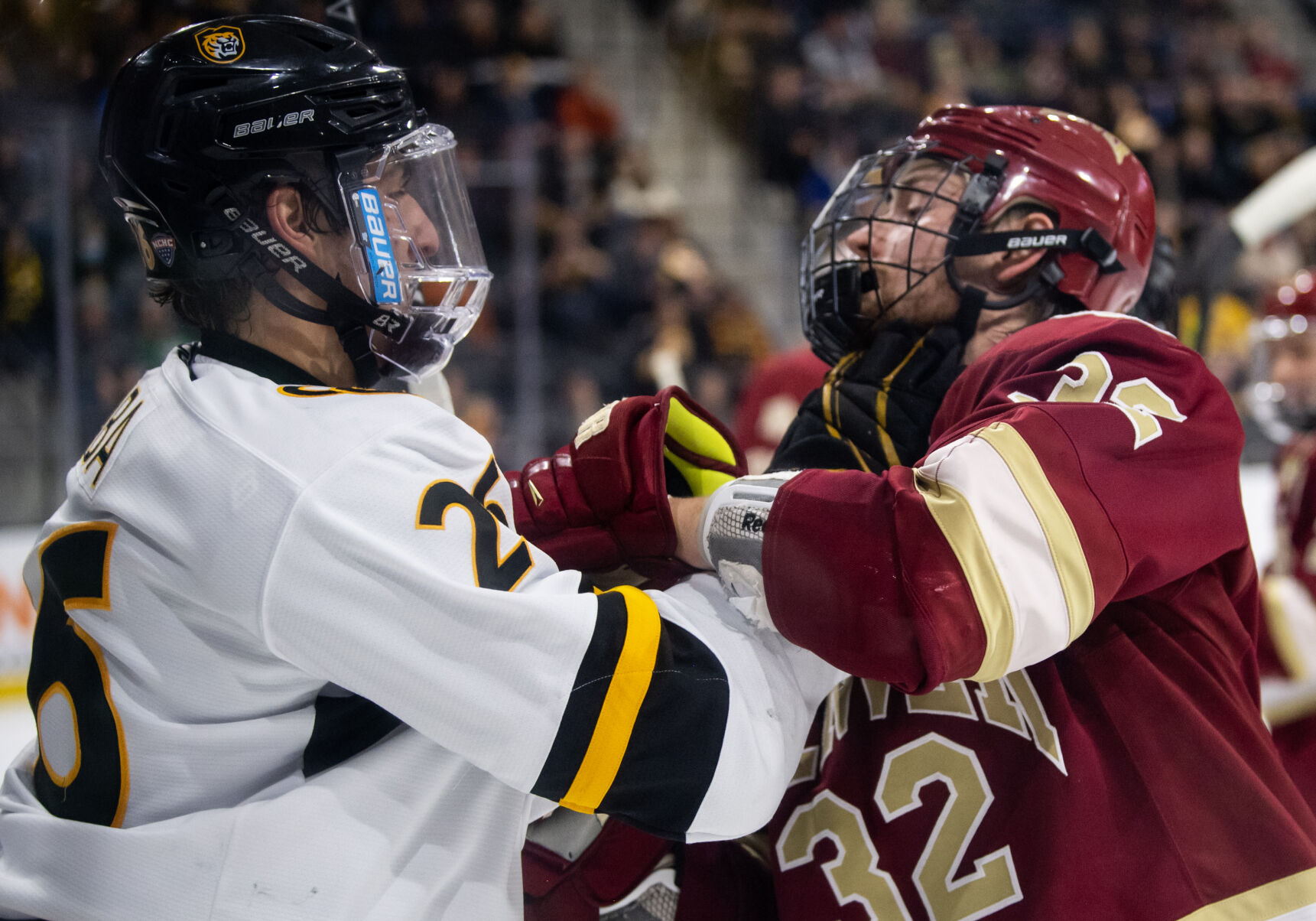 Colorado College forward Noah Laba (26) grabs Denver defenseman Justin Lee (32) in the third period of a hockey game on Saturday, Feb. 4, 2023, at Ed Robson Arena in Colorado Springs, Colo. (Parker Seibold, The Gazette) (Parker Seibold)