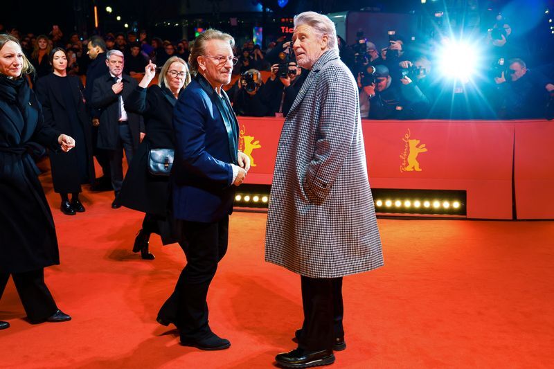 Bono and Adam Clayton of U2 attend the screening of the documentary movie 'Kiss the Future' at the 73rd Berlinale International Film Festival in Berlin, Germany, February 19, 2023. REUTERS/Fabrizio Bensch (FABRIZIO BENSCH)