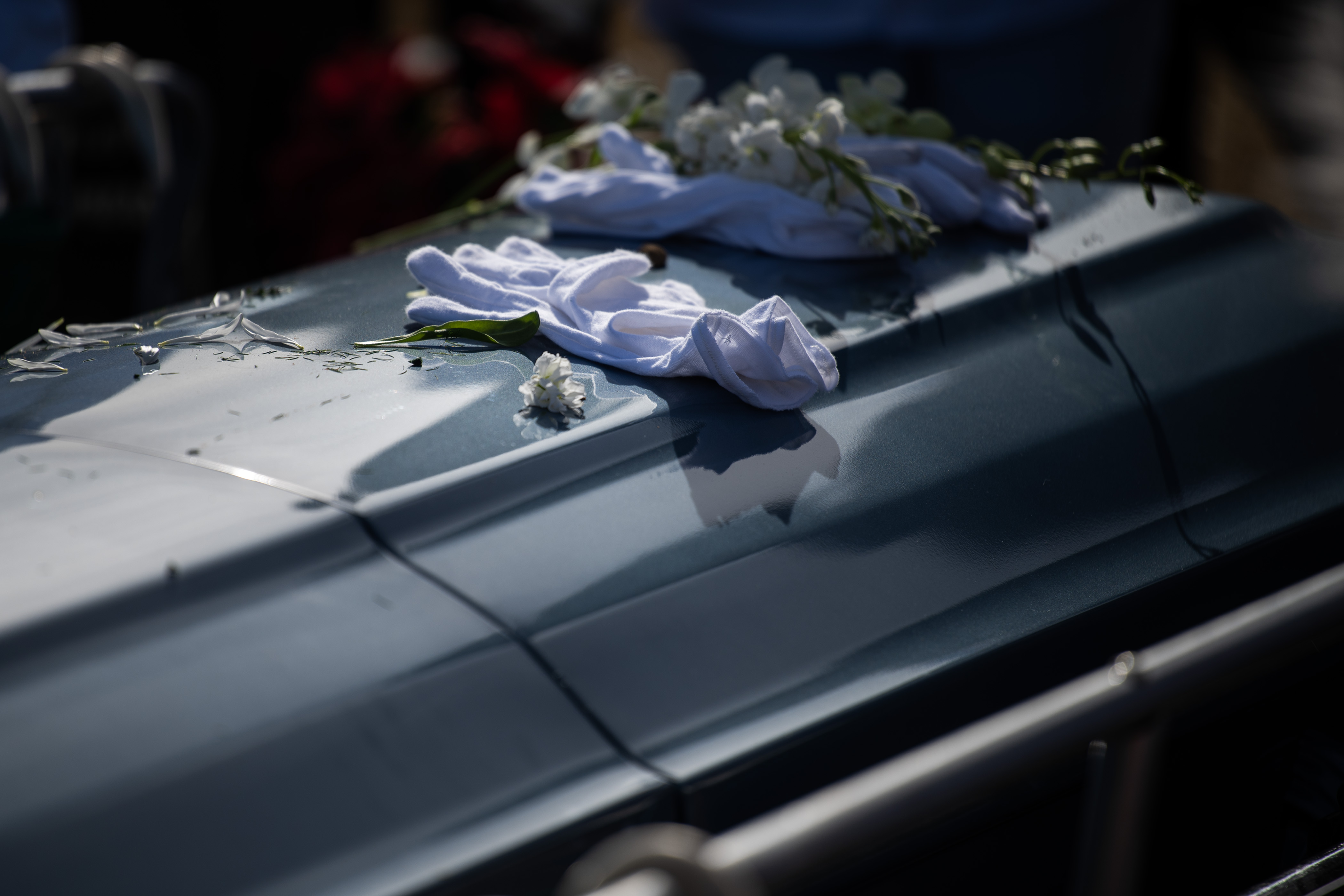 Pallbearers leave their gloves on the casket of Elias Alexander Armstrong, 12, before it’s lowered into the ground on Friday, Feb. 24, 2023, at Saint Simeon Catholic Cemetery in Aurora, Colo. (Timothy Hurst/The Denver Gazette) (TimHursttim.hurst@gazette.comhttps://secure.gravatar.com/avatar/aca82bd62b4ee425c598527cd6faa1b1?d=mm&r=g)