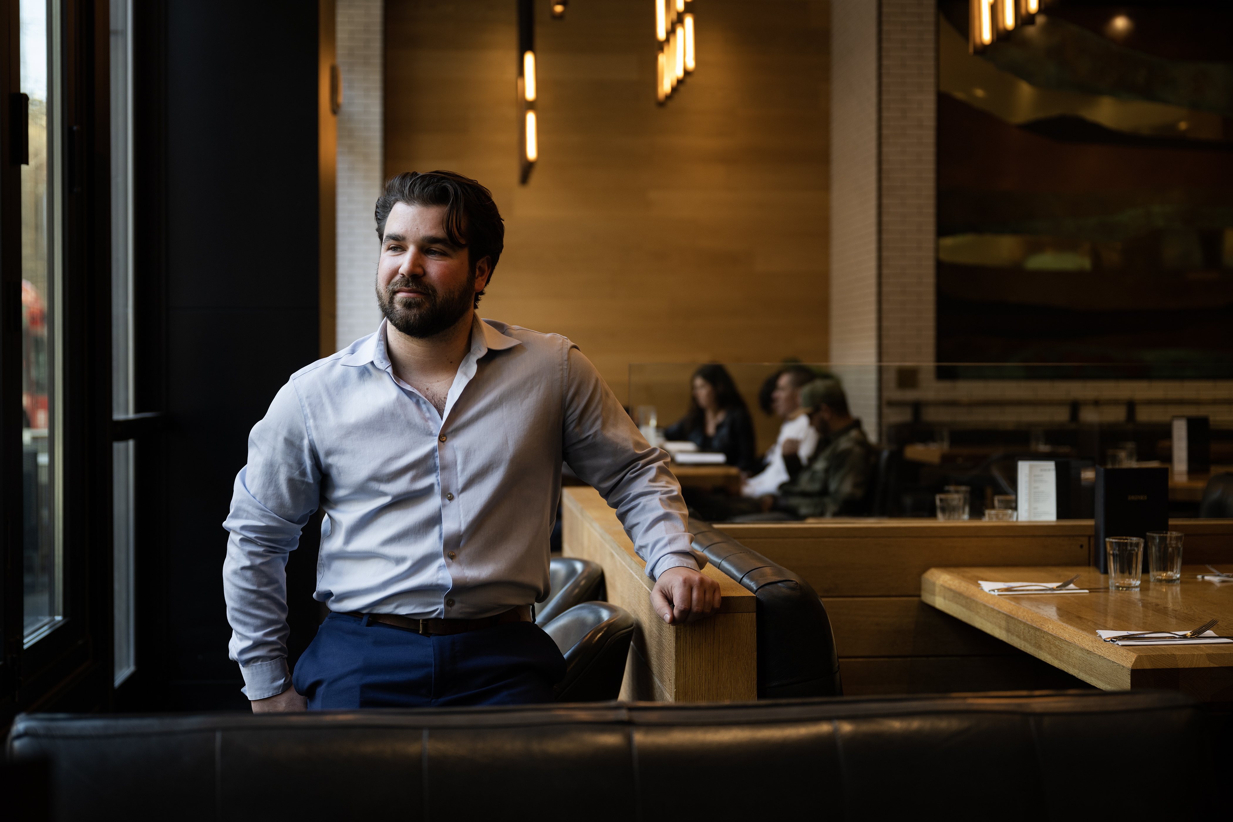 Earls Kitchen + Bar restaurant manager Tyler Caldwell sits for a portrait in the dining room on Friday, Feb. 17, 2023, in Denver, Colo. (Timothy Hurst/The Denver Gazette) (TimHursttim.hurst@gazette.comhttps://secure.gravatar.com/avatar/aca82bd62b4ee425c598527cd6faa1b1?d=mm&r=g)