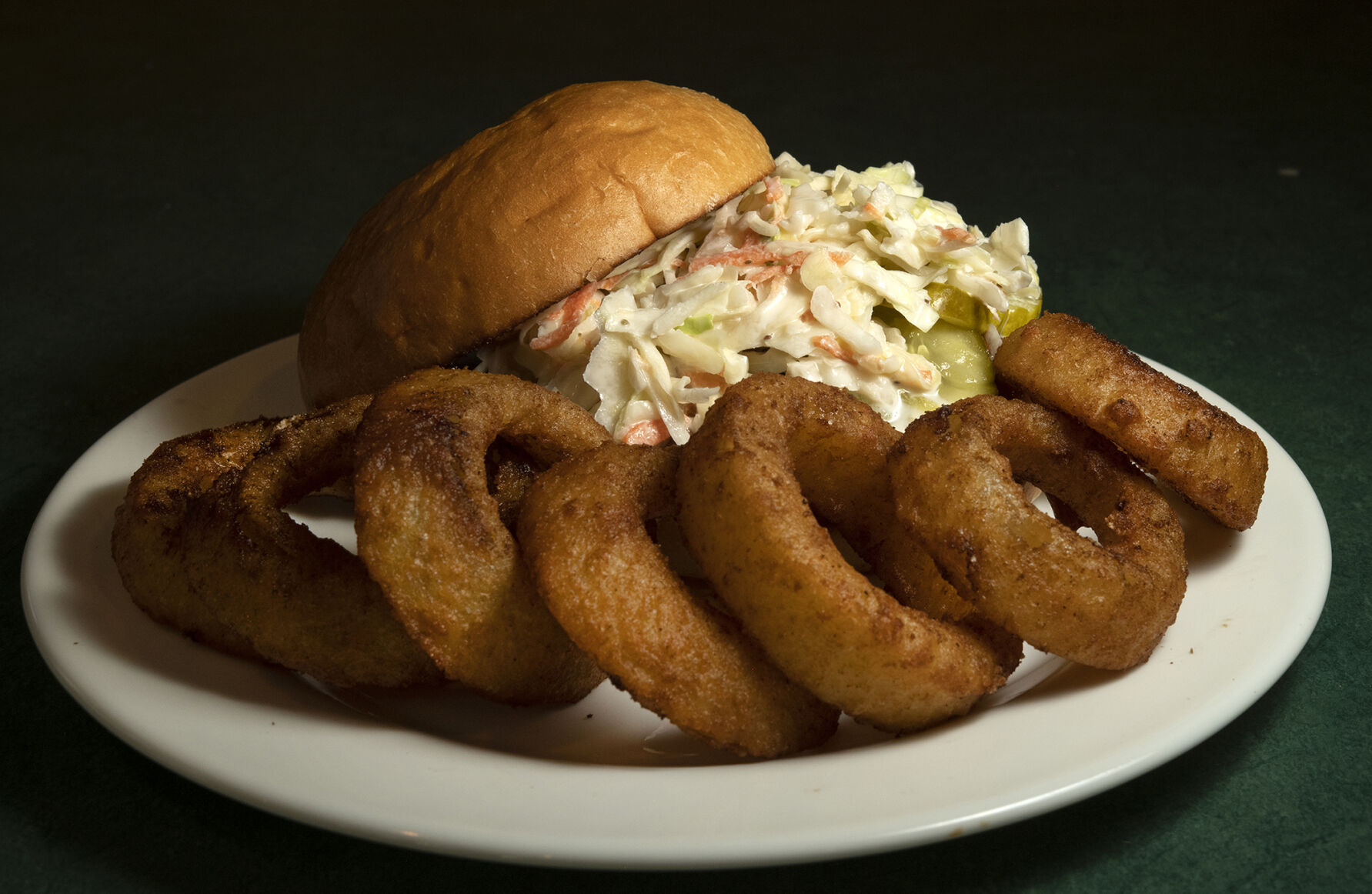 Cherry Cricket Restaurant (Located at: 2641 E. 2nd Ave. Denver, CO.) “Barbecue Pulled Pork Sandwich with Onion Rings” Thursday February 16, 2023. Photo by Jeff Kearney. (Jeff Kearney)