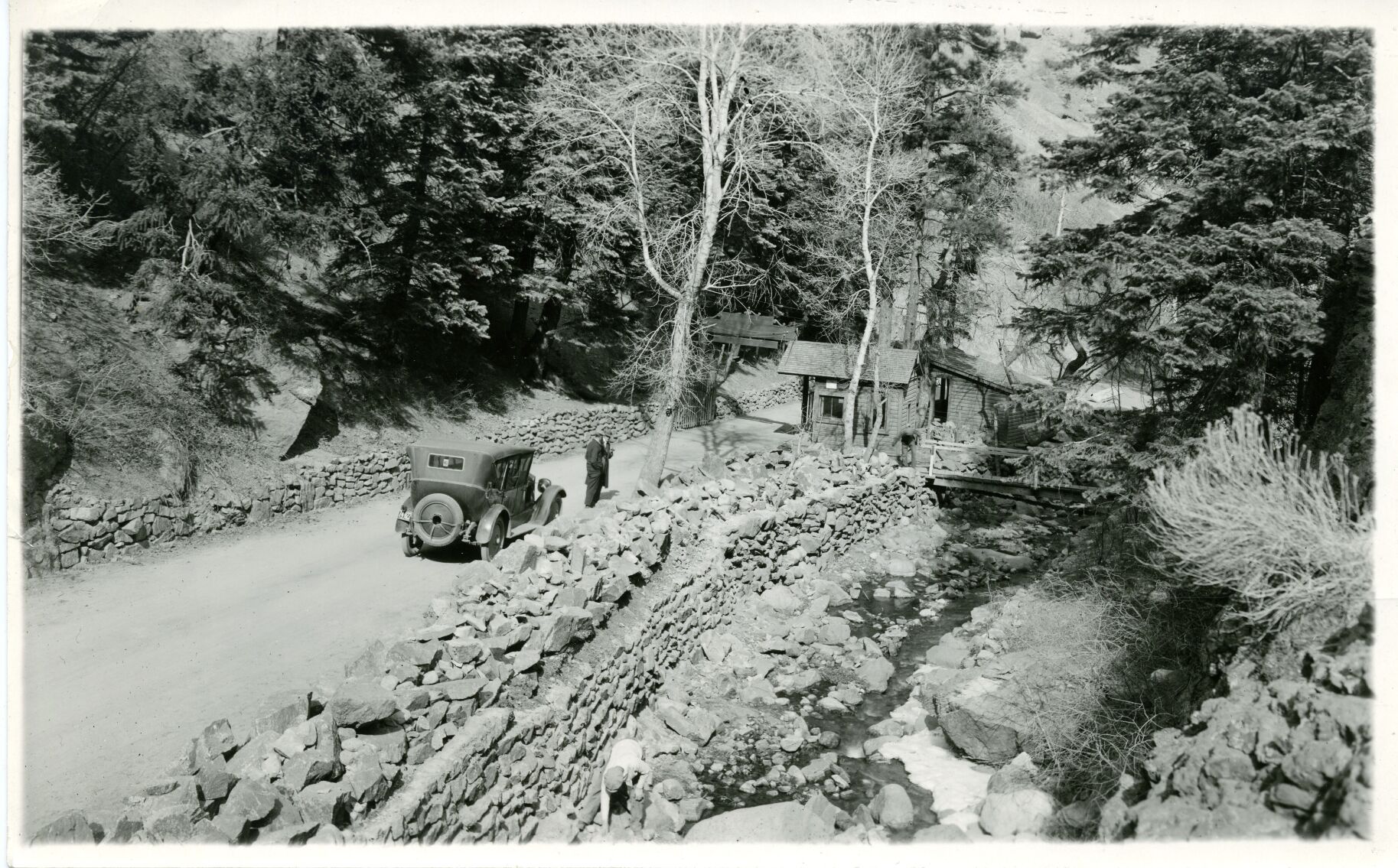 At top, the old road to Seven Falls winds through South Cheyenne Cañon. Above left, Babe Ruth and family visit Seven Falls in 1940. (Photos from Gusdorf/Weimer Family Collection)