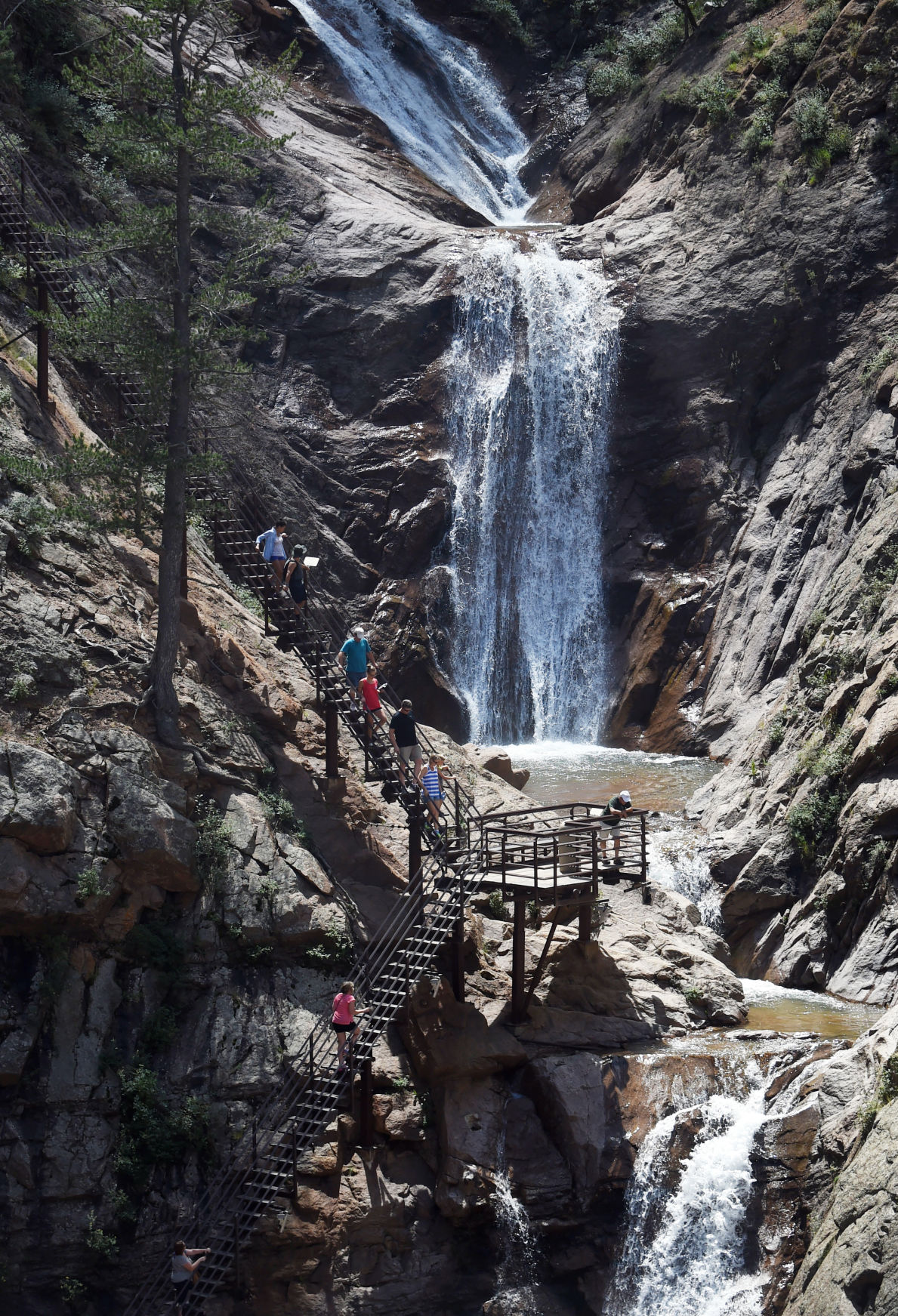 Visitors ascend the stairs along Seven Falls in South Cheyenne Canon. Photo by Jerilee Bennett (Jerilee Bennett)