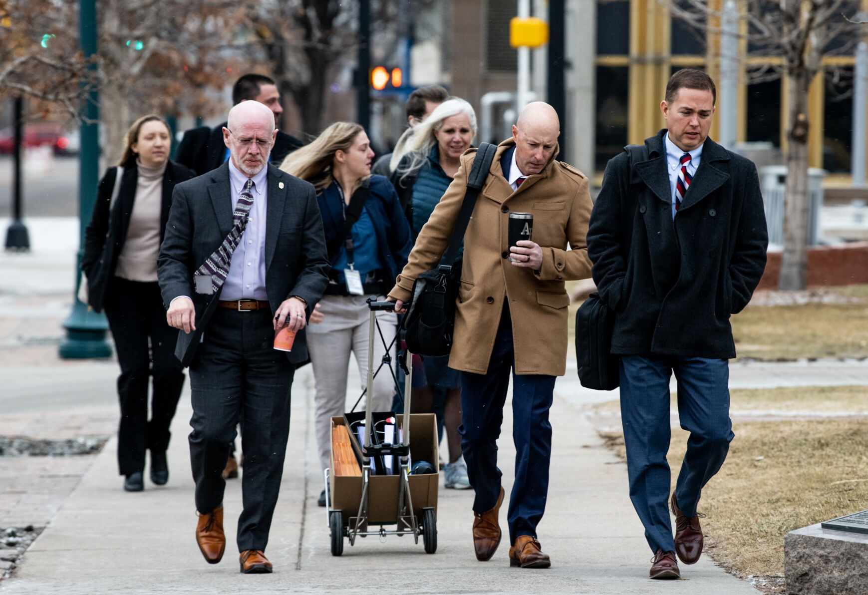 Fourth Judicial District Attorney Michael J. Allen, front right, leads attorneys into the El Paso County Courthouse on Wednesday for a preliminary hearing for Anderson Aldrich, the alleged perpetrator of the Club Q mass shooting. (PHOTOS BY Parker Seibold, The DENVER Gazette)