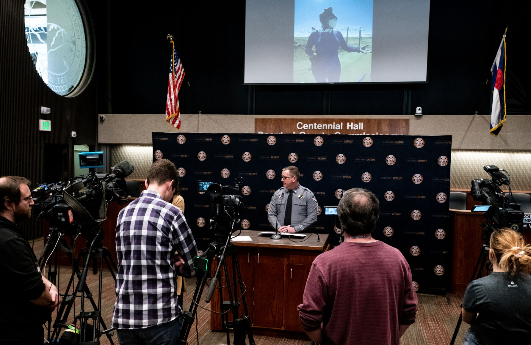 El Paso County Sheriff’s Office Lieutenant Chris Gonzalez watches footage of a police interaction with Nicole Mallery during a press conference regarding the conflict between the Mallery’s and their neighbor Teresa Clark, all farmers in Yoder, at Centennial Hall on Tuesday, Feb. 14, 2023. (Parker Seibold, The Gazette) (Parker Seibold)