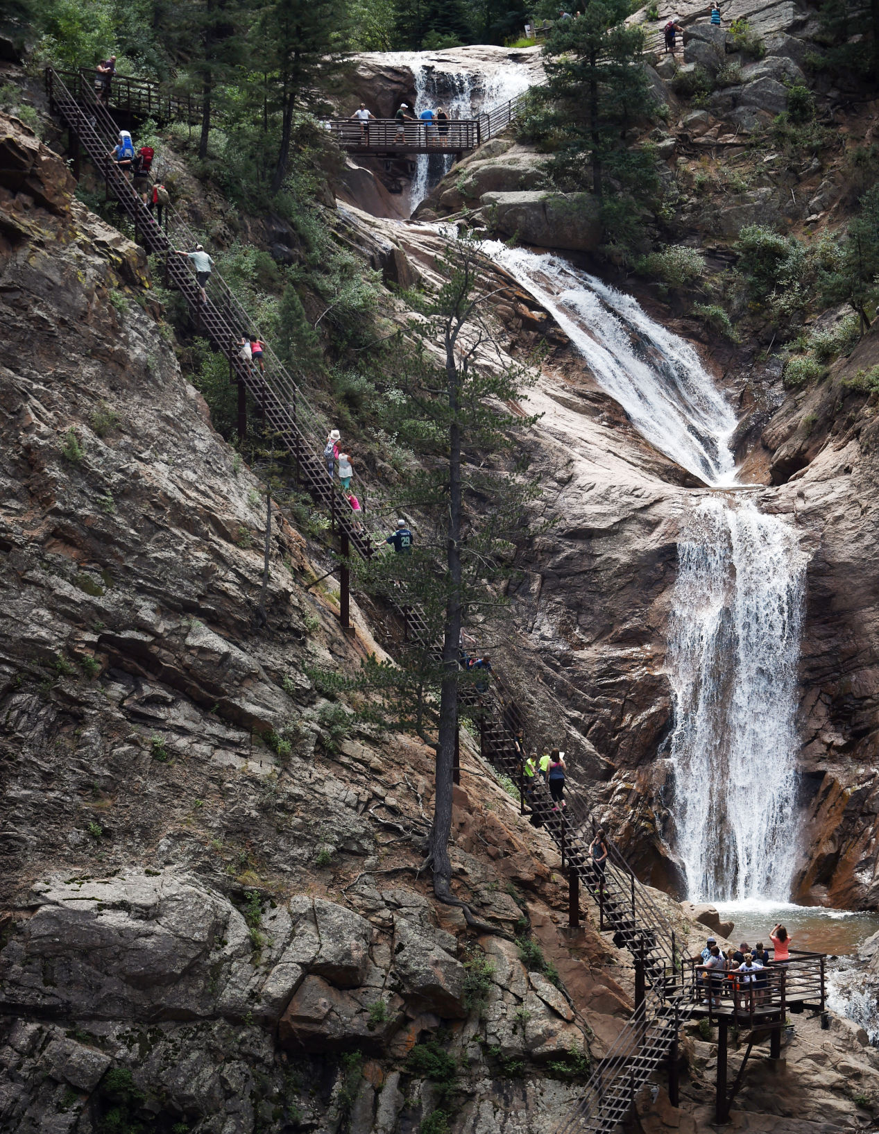 Visitors along the 224 steps spanning the side of Seven Falls. (Jerilee Bennett/Gazette file)
