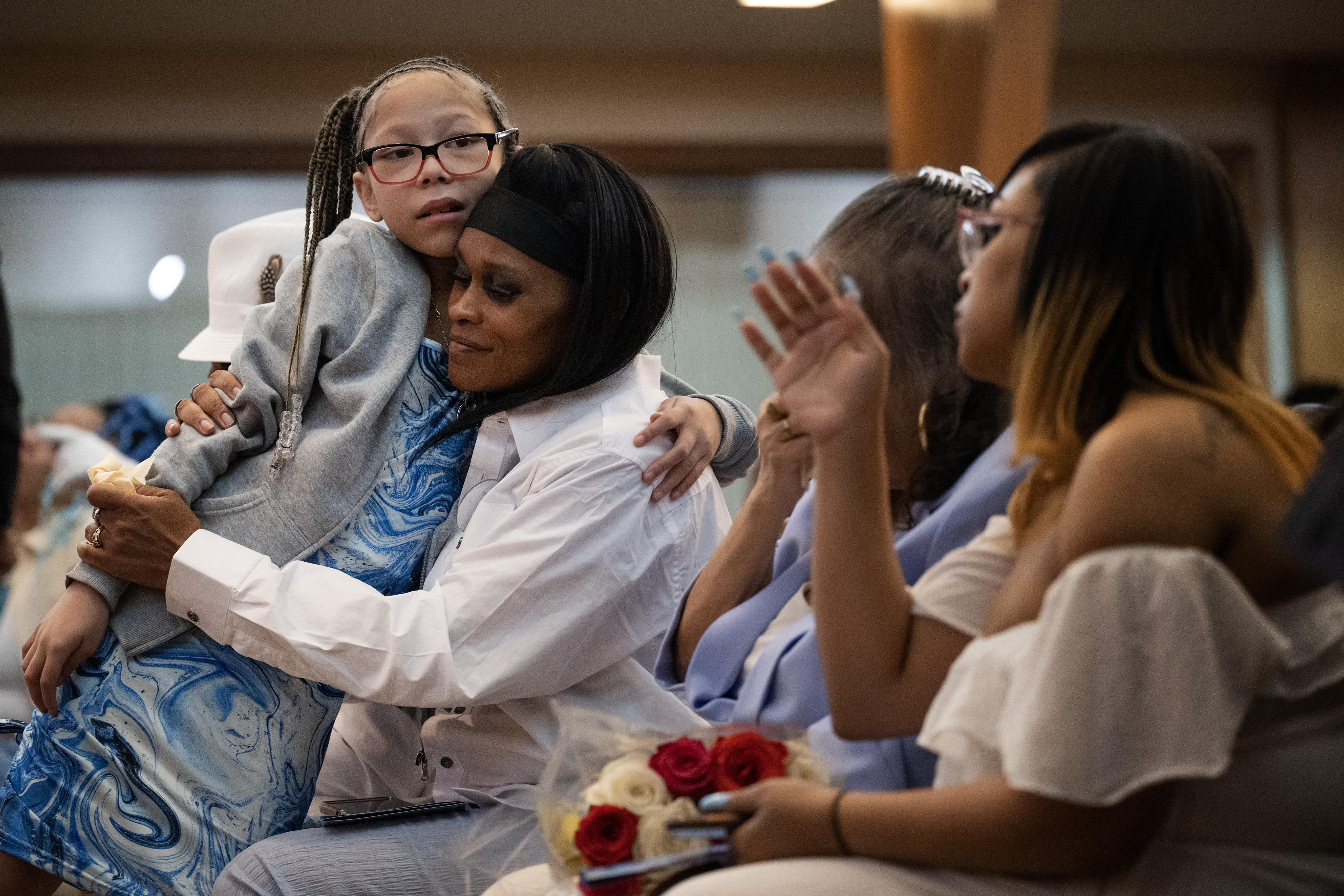 Aly’ja Levy, 10, hugs Elias Alexander Armstrong’s stepmother, Turquisha Moore-Armstrong, during the Celebration of Life ceremony for Armstrong, 12, on Friday, Feb. 24, 2023, at Pipkin Braswell Funeral Home in Denver. (TimHursttim.hurst@gazette.comhttps://secure.gravatar.com/avatar/aca82bd62b4ee425c598527cd6faa1b1?d=mm&r=g)