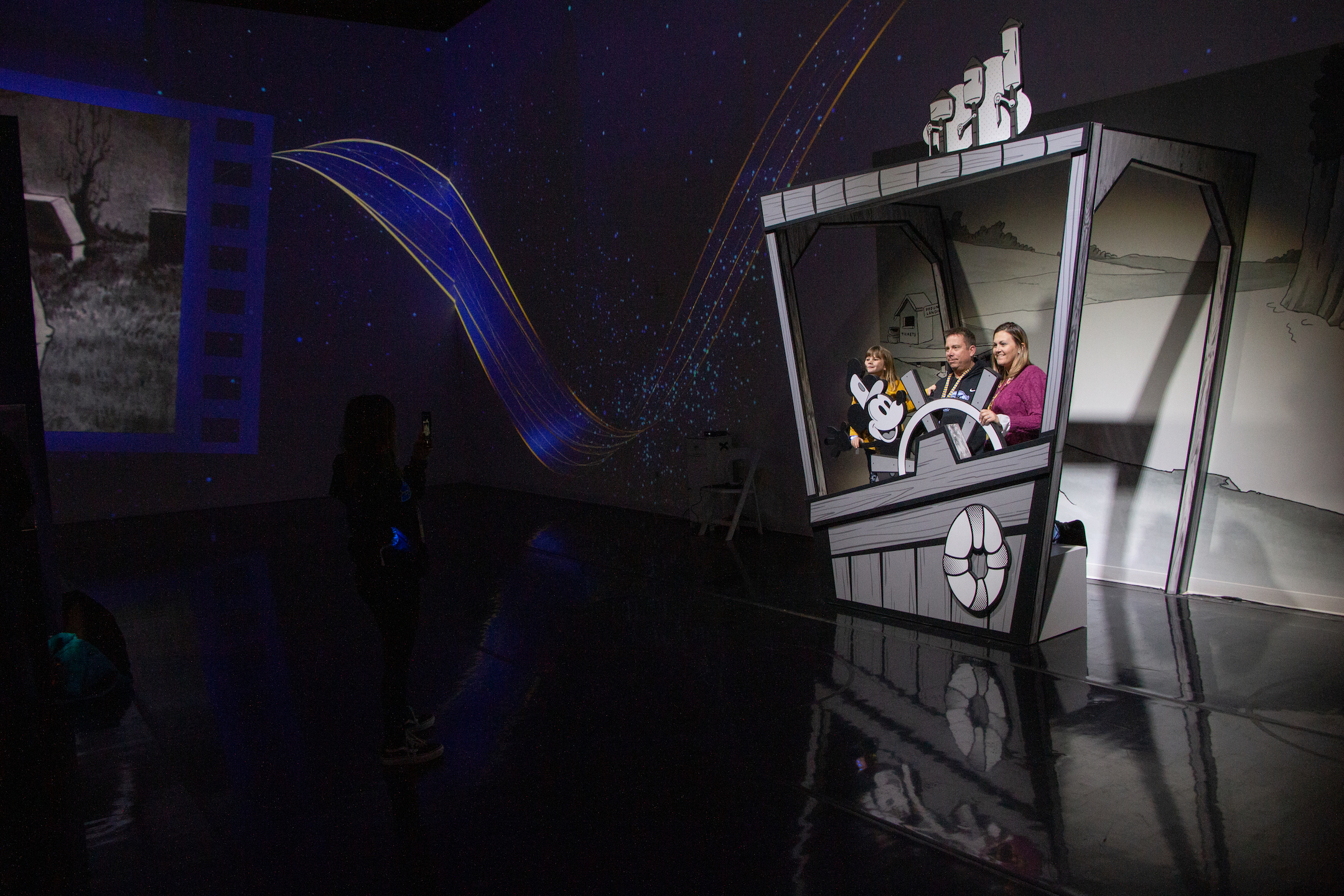 A family poses together at the Disney Animation: Immersive Experience is now open at Lighthouse Art Space Denver, 3900 Elati St. on Feb. 15. (SavannahMehrtenssavannah.mehrtens@denvergazette.comhttps://secure.gravatar.com/avatar/e0e72b1f57c381b73731db78749ceca8?d=mm&r=g)
