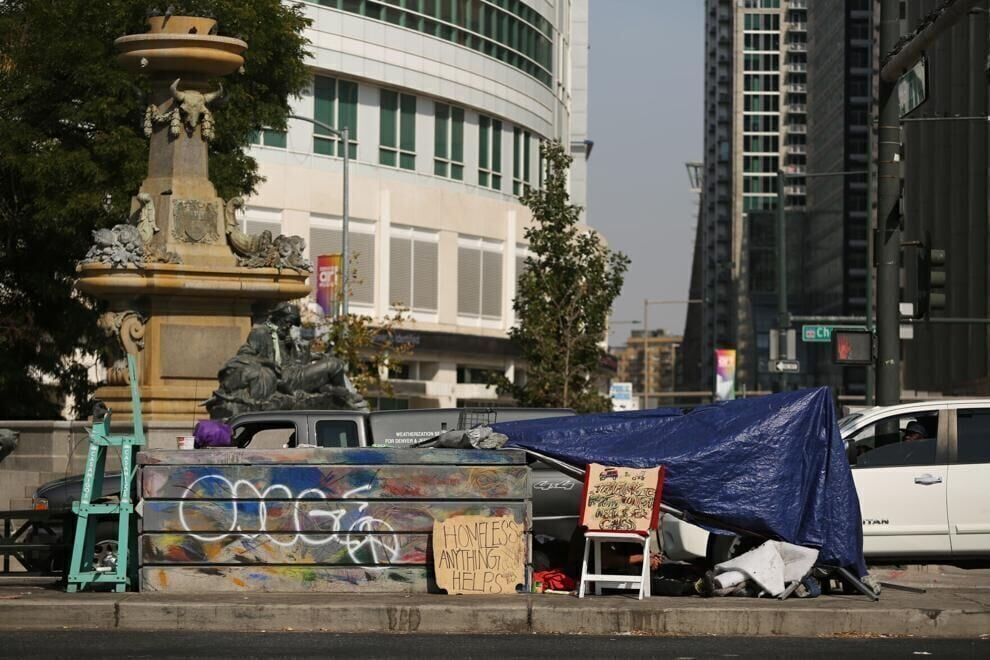 A makeshift shelter sits in the median of Colfax Avenue in Denver. (GAZETTE file)