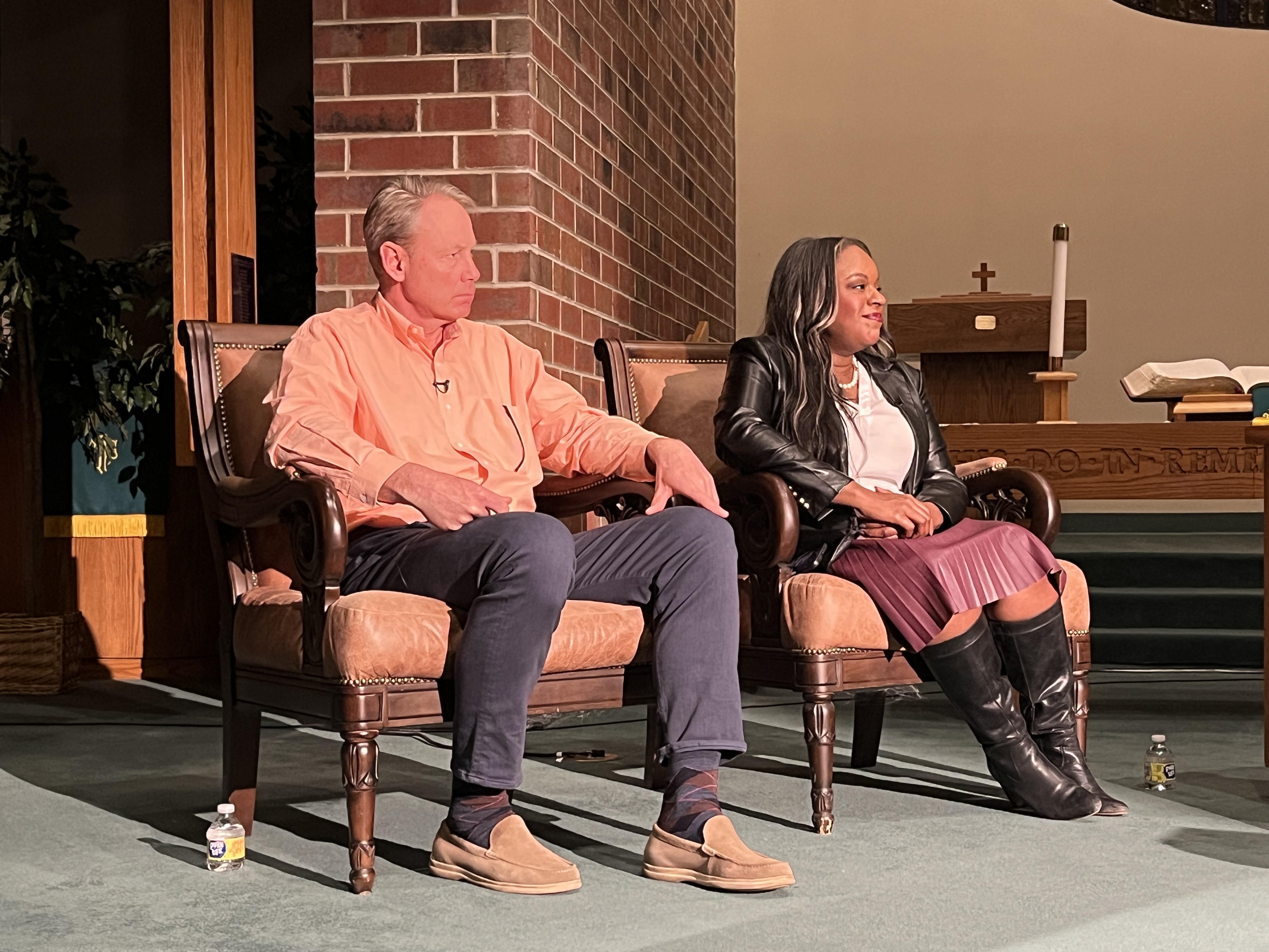 Thomas Wolf (left) and State Rep. Leslie Herod (middle) appear on stage for a mayoral forum hosted by PBS 12. The two disagreed on some of the minutia on solving the homelessness crisis, but agreed people needed to be sheltered. (Alex Edwards/The Denver Gazette)