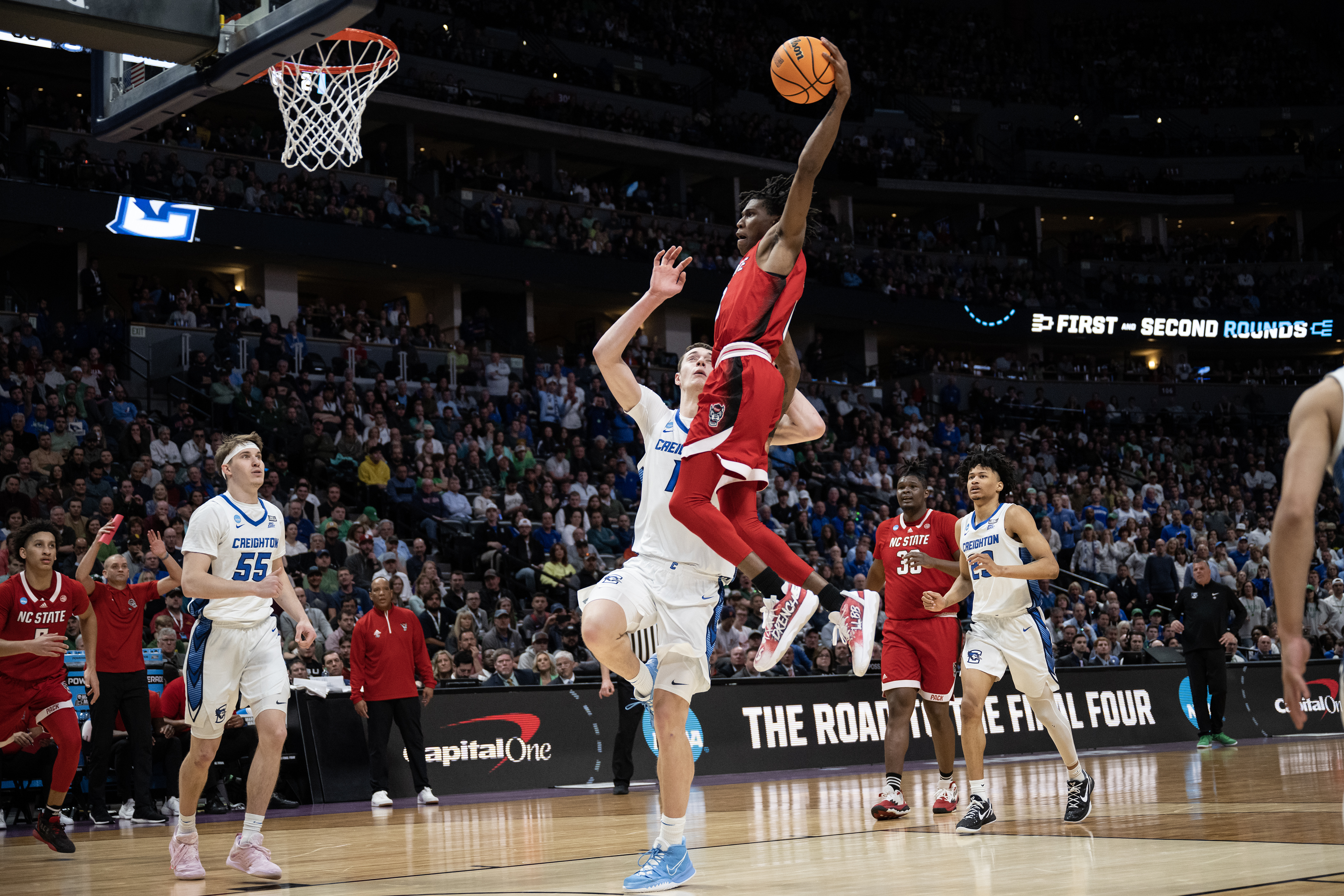 North Carolina State Wolfpack guard Terquavion Smith (0) dunks over Creighton Bluejays center Ryan Kalkbrenner (11) during a first-round college basketball game in the NCAA Tournament on Friday, March 17, 2023, at Ball Arena in Denver, Colo. (Timothy Hurst/Denver Gazette) (TimHursttim.hurst@gazette.comhttps://secure.gravatar.com/avatar/aca82bd62b4ee425c598527cd6faa1b1?d=mm&r=g)