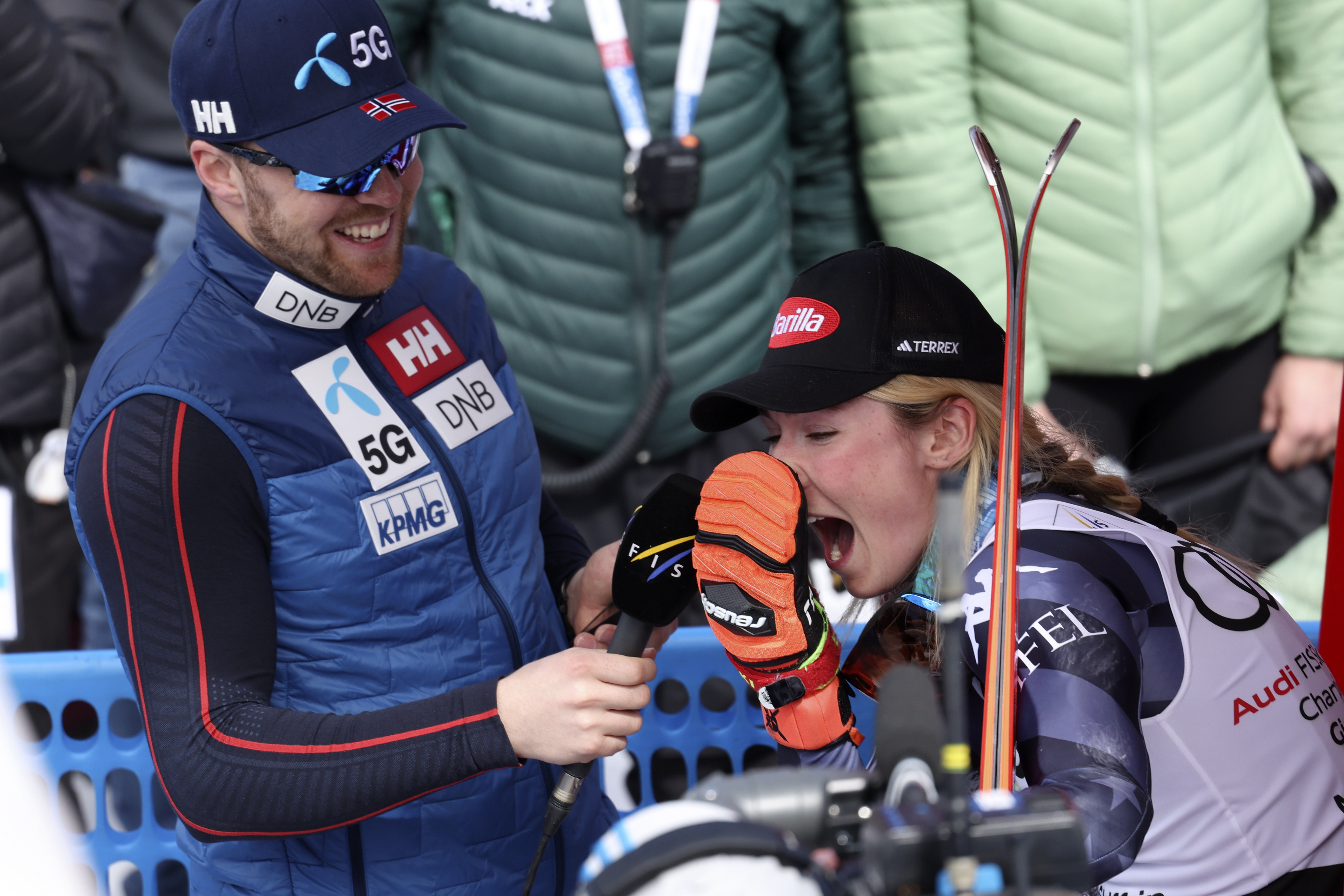 Norway's Aleksander Aamodt Kilde, left, interviews United States' Mikaela Shiffrin after she won an alpine ski, women's World Cup giant slalom race, in Soldeu, Andorra, Sunday, March 19, 2023. (Alessandro Trovati - stringer, AP)
