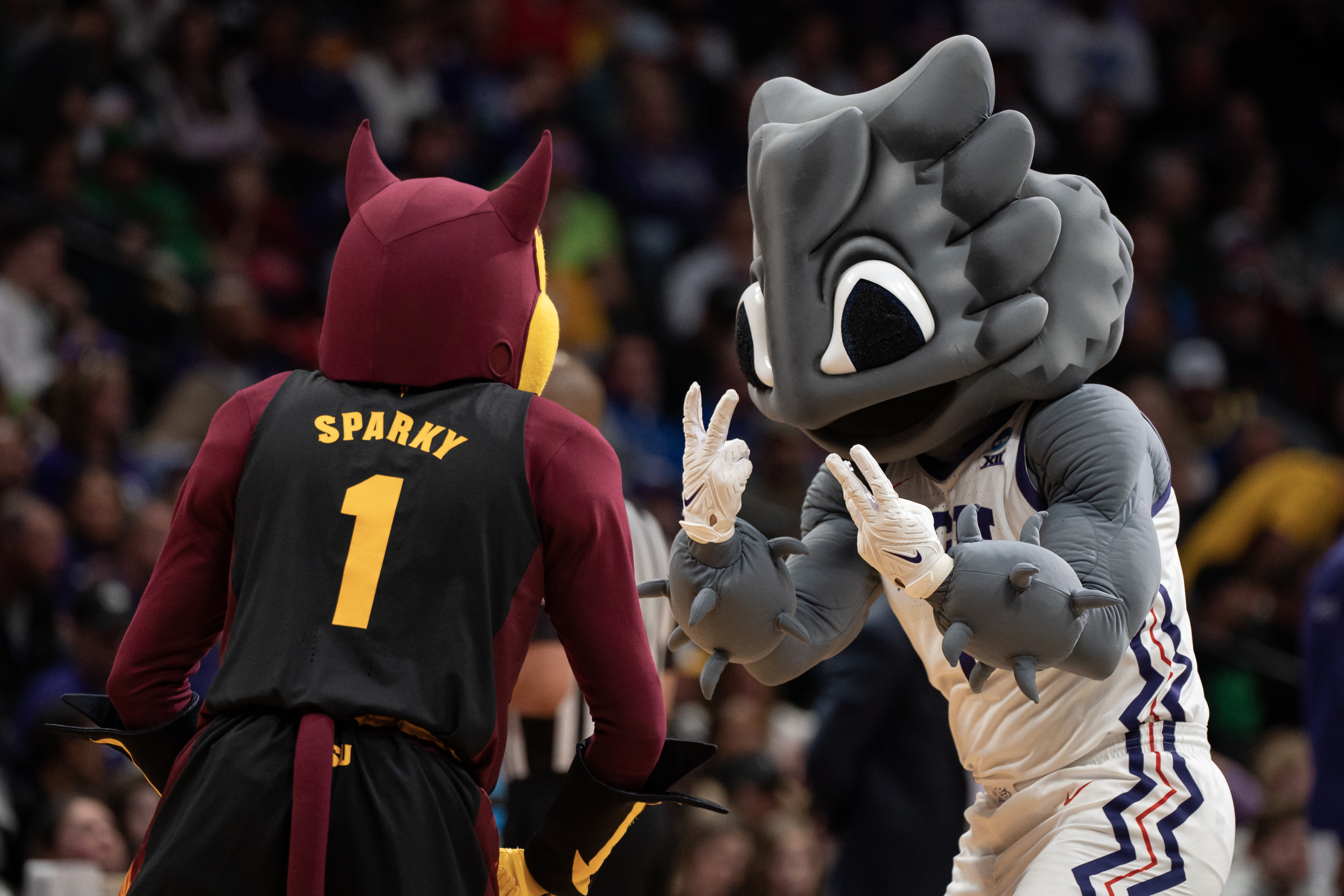 The TCU Horned Frogs and Arizona State Sun Devils mascots meet at mid-court during a first-round college basketball game in the NCAA Tournament on Friday, March 17, 2023, at Ball Arena in Denver, Colo. (Timothy Hurst/Denver Gazette) (TimHursttim.hurst@gazette.comhttps://secure.gravatar.com/avatar/aca82bd62b4ee425c598527cd6faa1b1?d=mm&r=g)