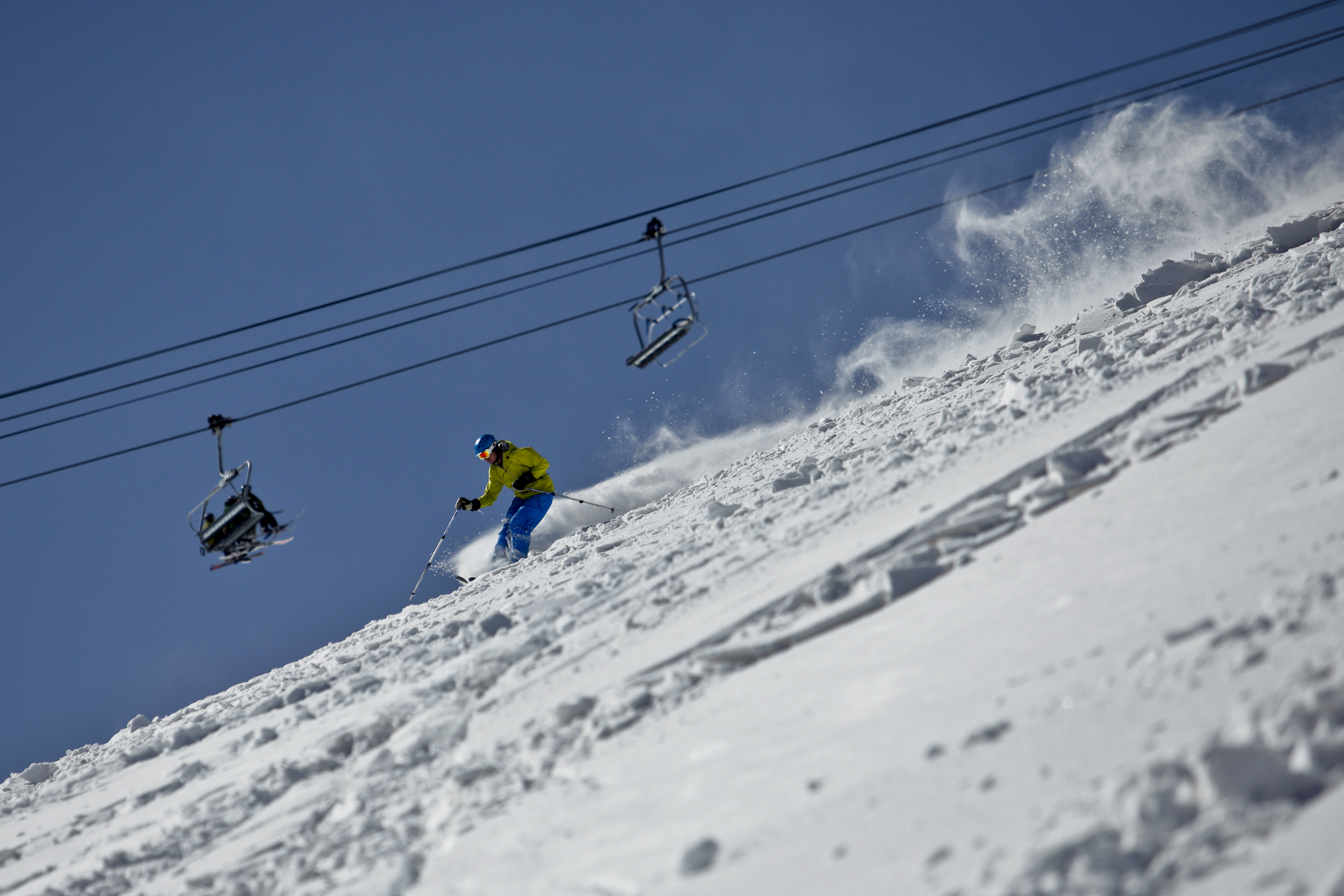 A skier enjoys fresh snow underneath the Panoramic Express lift Tuesday, April 16, 2013 at Winter Park Resort in Winter Park, Colorado. (Jonathan Ingraham/Denver Gazette)