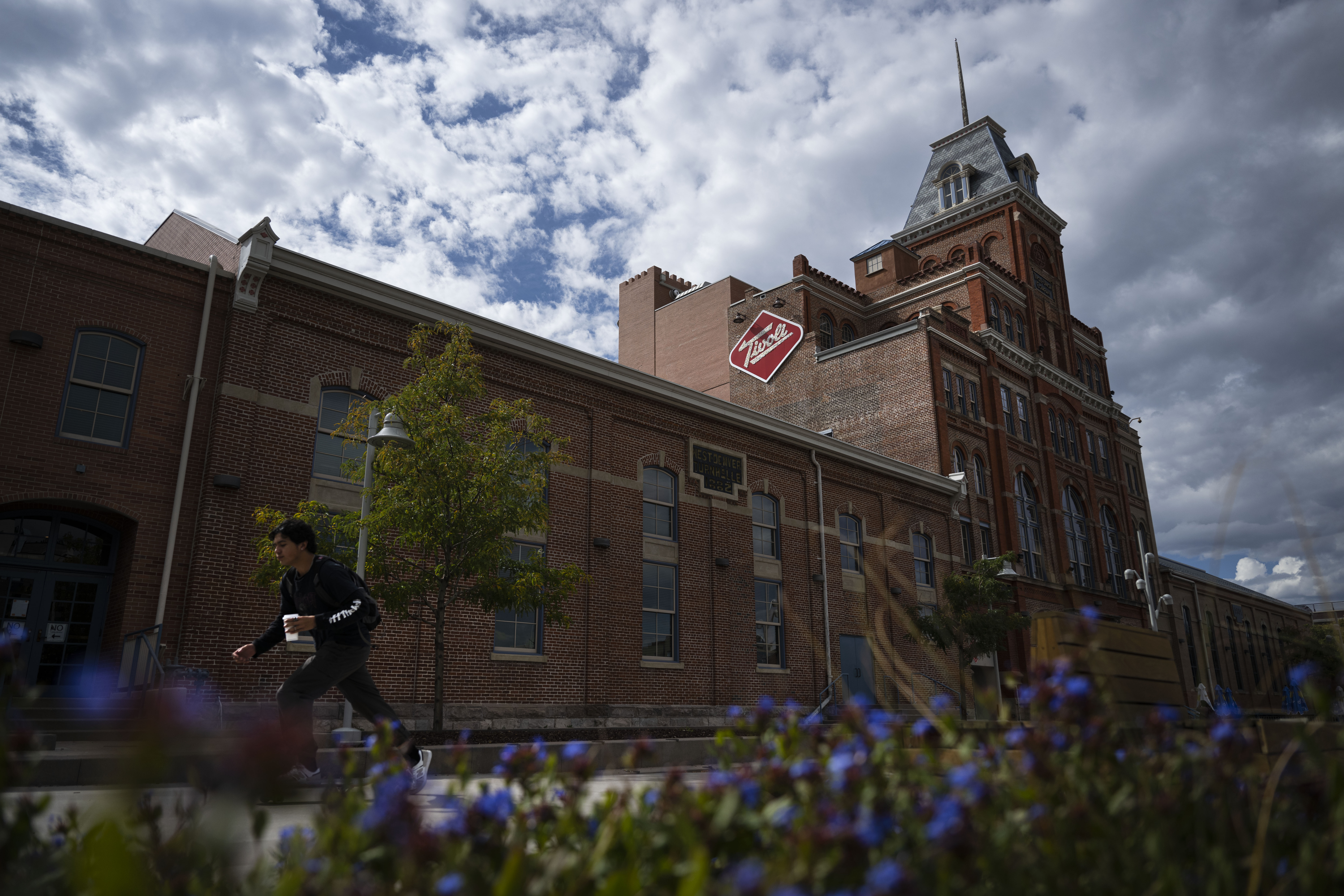 A student skateboards past the Tivoli Brewery building on Thursday, Sept. 29, 2022, on the Auraria Campus in Denver, Colo. (Timothy Hurst/The Gazette) (TimHursttim.hurst@gazette.comhttps://secure.gravatar.com/avatar/aca82bd62b4ee425c598527cd6faa1b1?d=mm&r=g)