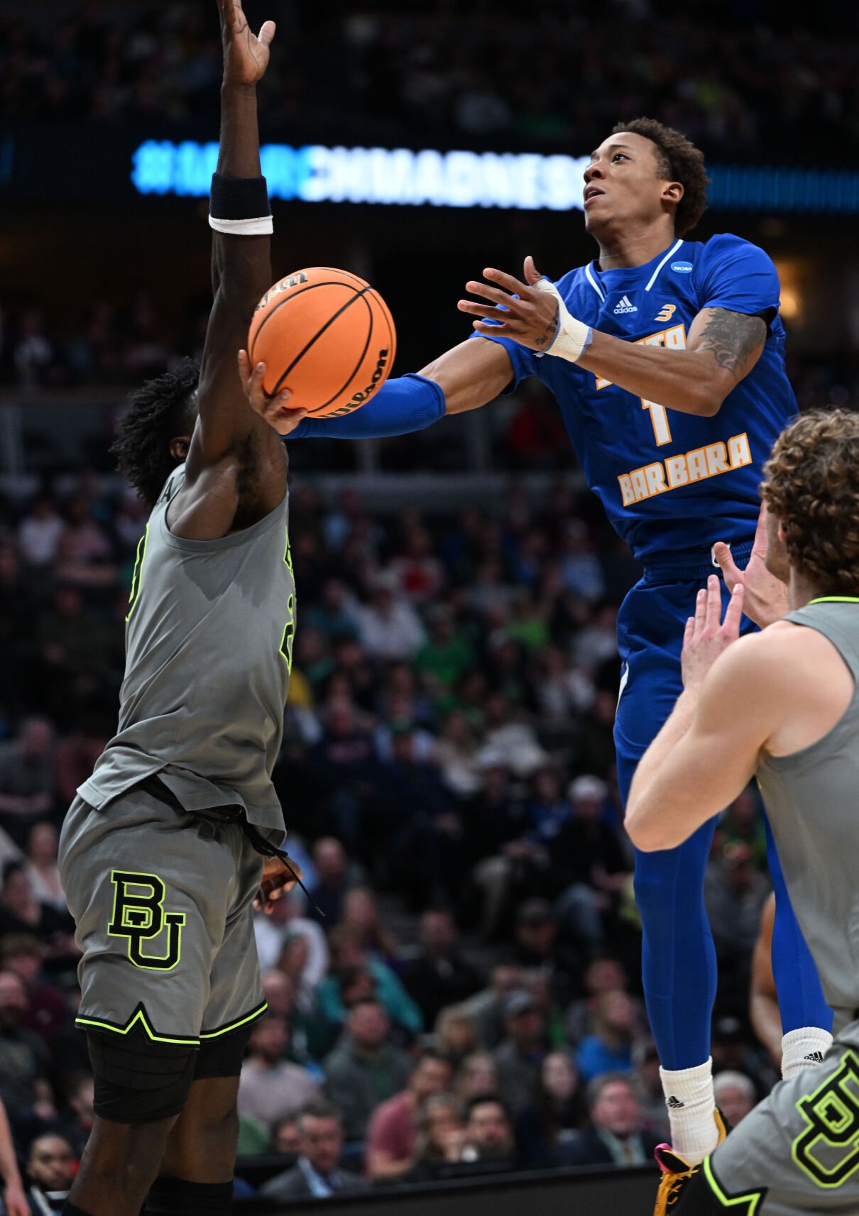 UC Santa Barbara Gauchos guard Josh Pierre-Louis (1) goes up for as shot against Baylor Bears forward Jonathan Tchamwa Tchatchoua (23) left, and forward Caleb Lohner (33) during the first half of a first round of the Men’s NCAA Tournament Friday, March 17, 2023, at Ball Arena in Denver. (The Gazette, Christian Murdock) (Christian Murdock/The Gazette)