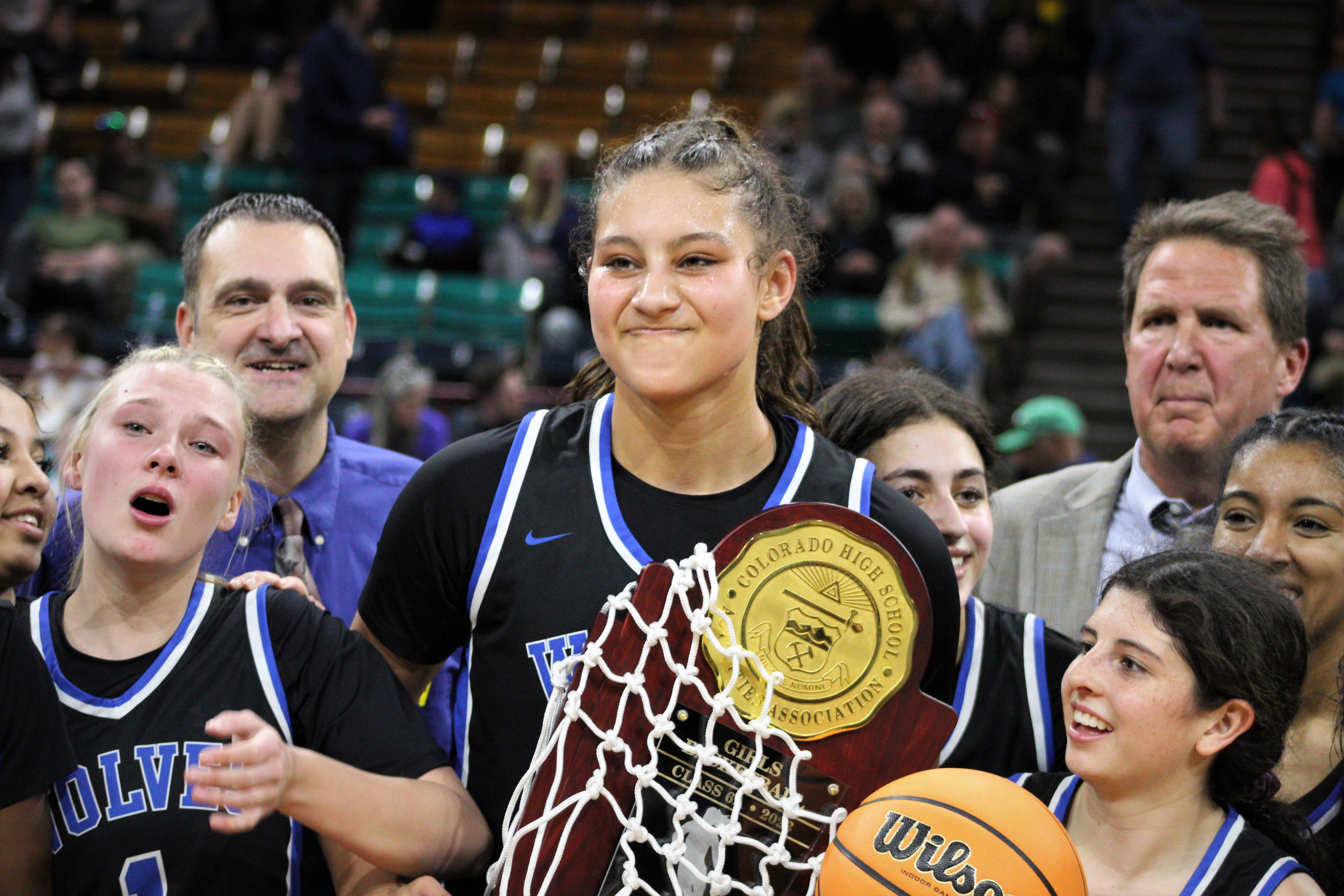 Grandview sophomore Sienna Betts (center) celebrates with her team after defeating Monarch in the 6A girls basketball championship game on Saturday, March 11, 2023 at the Denver Coliseum. (Tyler King, The Denver Gazette)