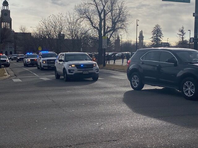 Denver police and DPS public safety vehicles accompanied the over 1,000 marchers from East High to the state capitol Friday. (Carol McKinley/Denver Gazette)