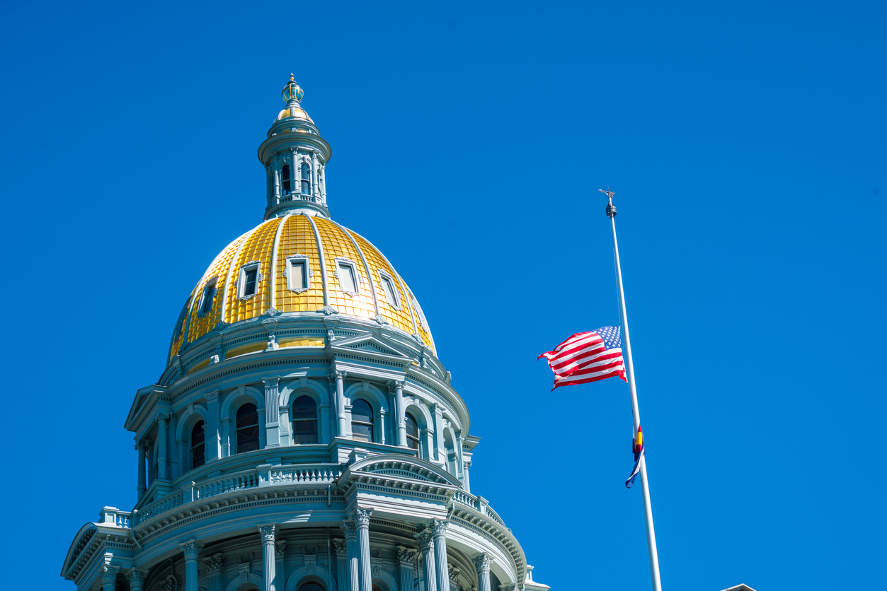 Why are flags at half-staff in Colorado?