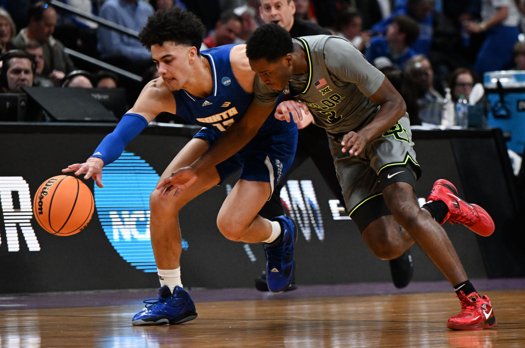 Baylor Bears guard Dale Bonner (3) battles UC Santa Barbara Gauchos guard Ajay Mitchell (13) for a loose ball during the second half of a first round of the Men’s NCAA Tournament Friday, March 17, 2023, at Ball Arena in Denver. Baylor defeated UC Santa Barbara 74-56. (The Gazette, Christian Murdock) (Christian Murdock/The Gazette)