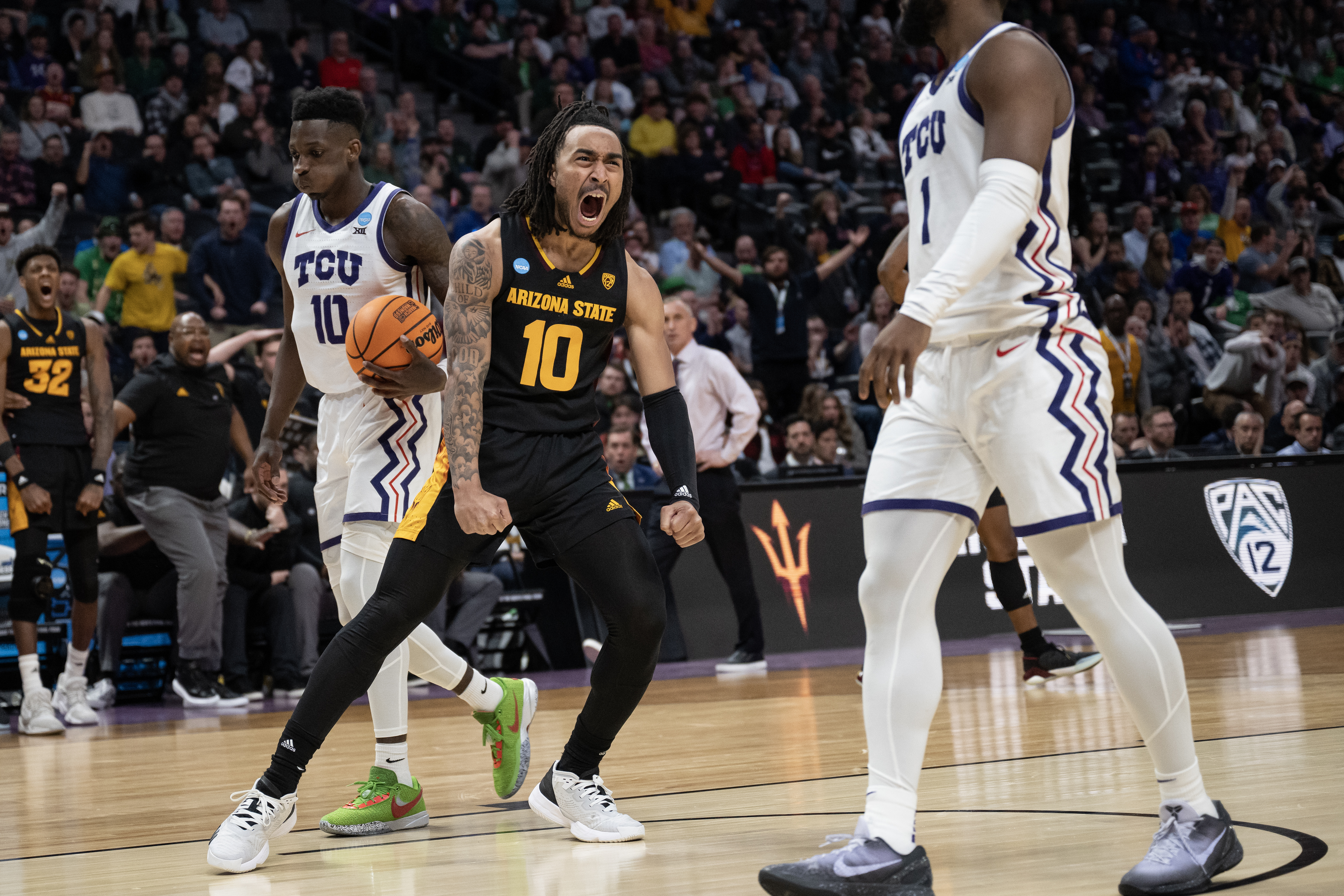 Arizona State Sun Devils guard Frankie Collins (10) reacts after dunking over TCU Horned Frogs forward Chuck O'Bannon Jr. (5) during a first-round college basketball game in the NCAA Tournament on Friday, March 17, 2023, at Ball Arena in Denver, Colo. (Timothy Hurst/Denver Gazette) (TimHursttim.hurst@gazette.comhttps://secure.gravatar.com/avatar/aca82bd62b4ee425c598527cd6faa1b1?d=mm&r=g)