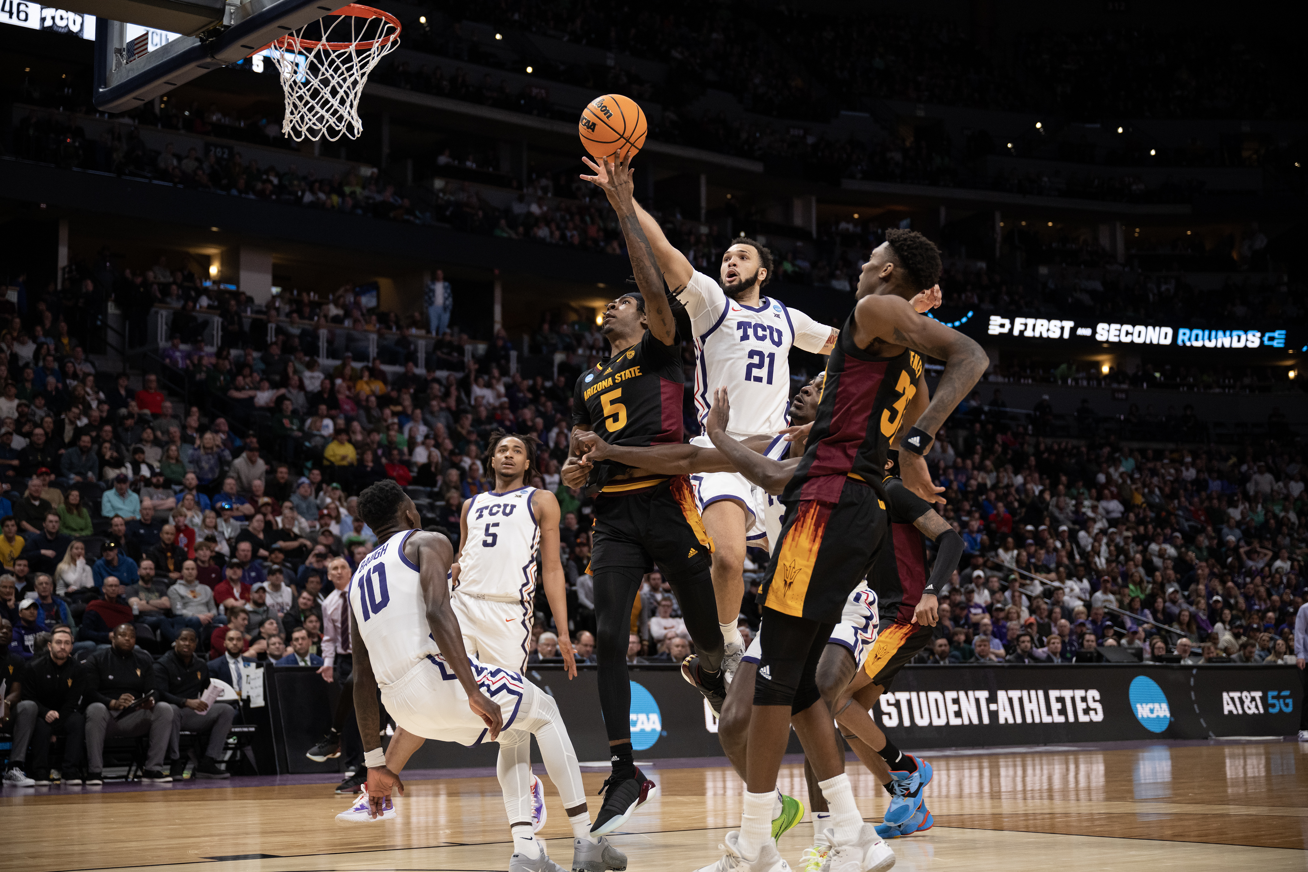TCU Horned Frogs forward JaKobe Coles (21) blocks a shot by Arizona State Sun Devils forward Jamiya Neal (5) during a first-round college basketball game in the NCAA Tournament on Friday, March 17, 2023, at Ball Arena in Denver, Colo. (Timothy Hurst/Denver Gazette) (TimHursttim.hurst@gazette.comhttps://secure.gravatar.com/avatar/aca82bd62b4ee425c598527cd6faa1b1?d=mm&r=g)