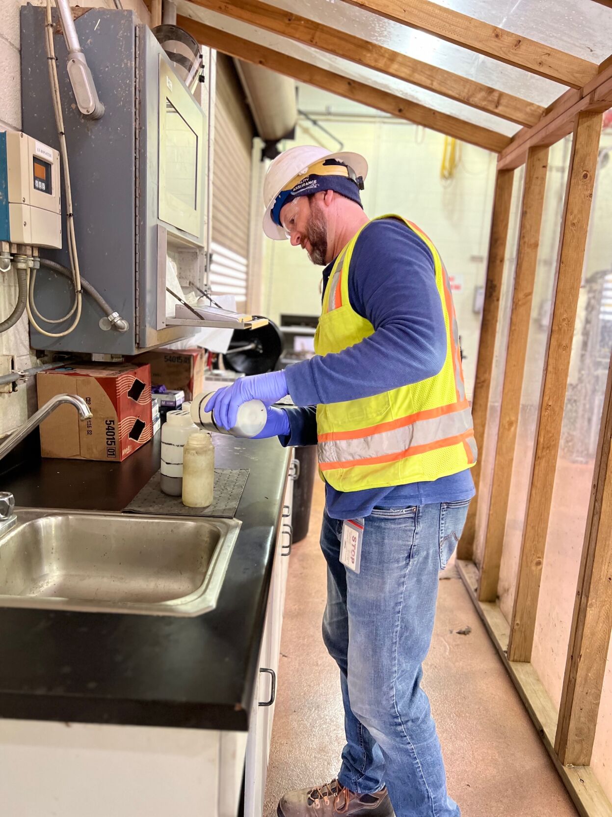 Colorado Springs Utilities' environmental specialist John Lewis collect samples of wastewater, which are tested for COVID-19 presence to detect spread of the virus. The human body produces antibodies to fight infection and expels particles, which can be found during laboratory analysis of excrement. (Courtesy of Colorado Springs Utilities)