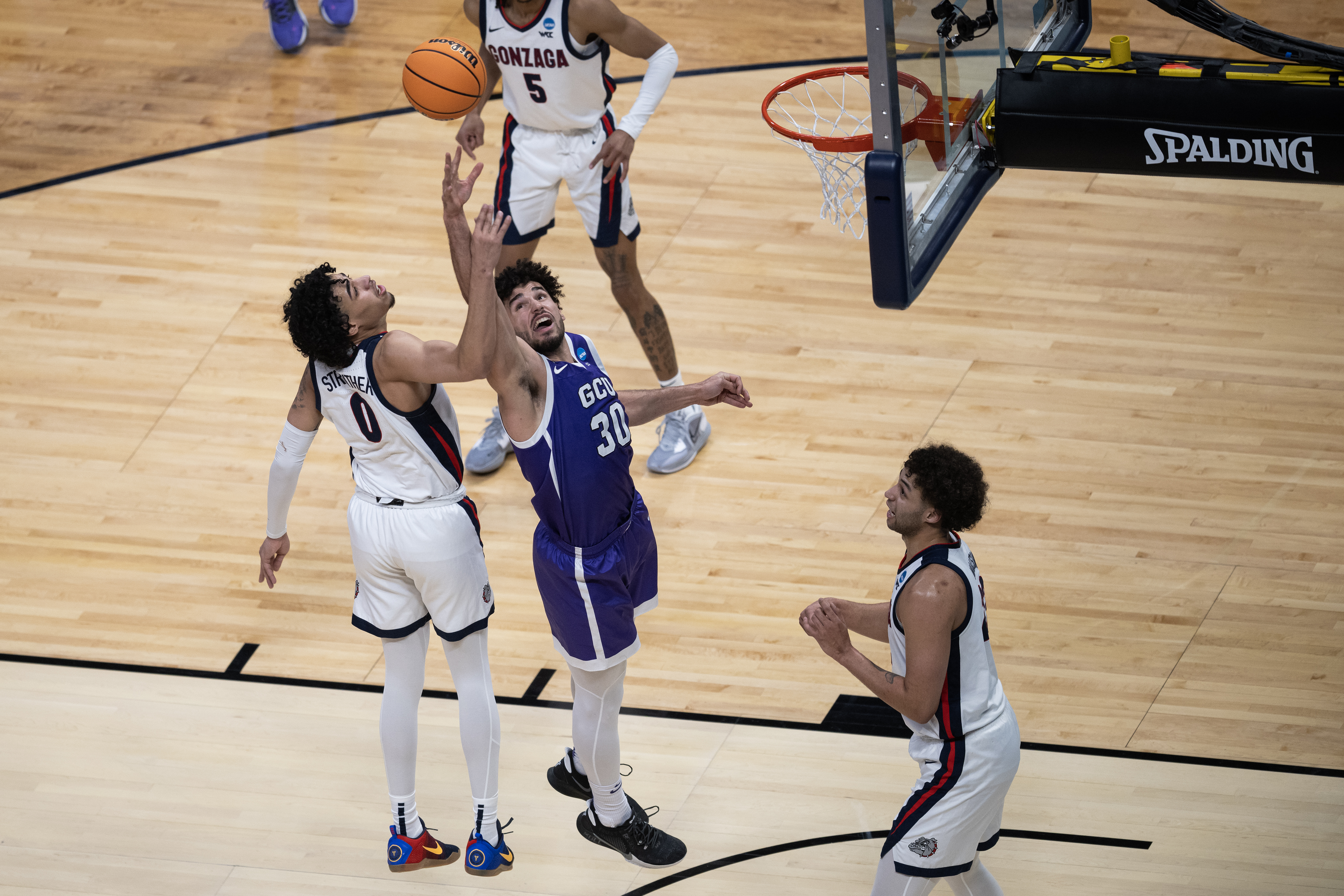 Grand Canyon Antelopes forward Gabe McGlothan (30) has a shot blocked by Gonzaga Bulldogs guard Julian Strawther (0) during a first-round college basketball game in the NCAA Tournament on Friday, March 17, 2023, at Ball Arena in Denver, Colo. (Timothy Hurst/Denver Gazette) (Timothy Hurst/Denver Gazette)