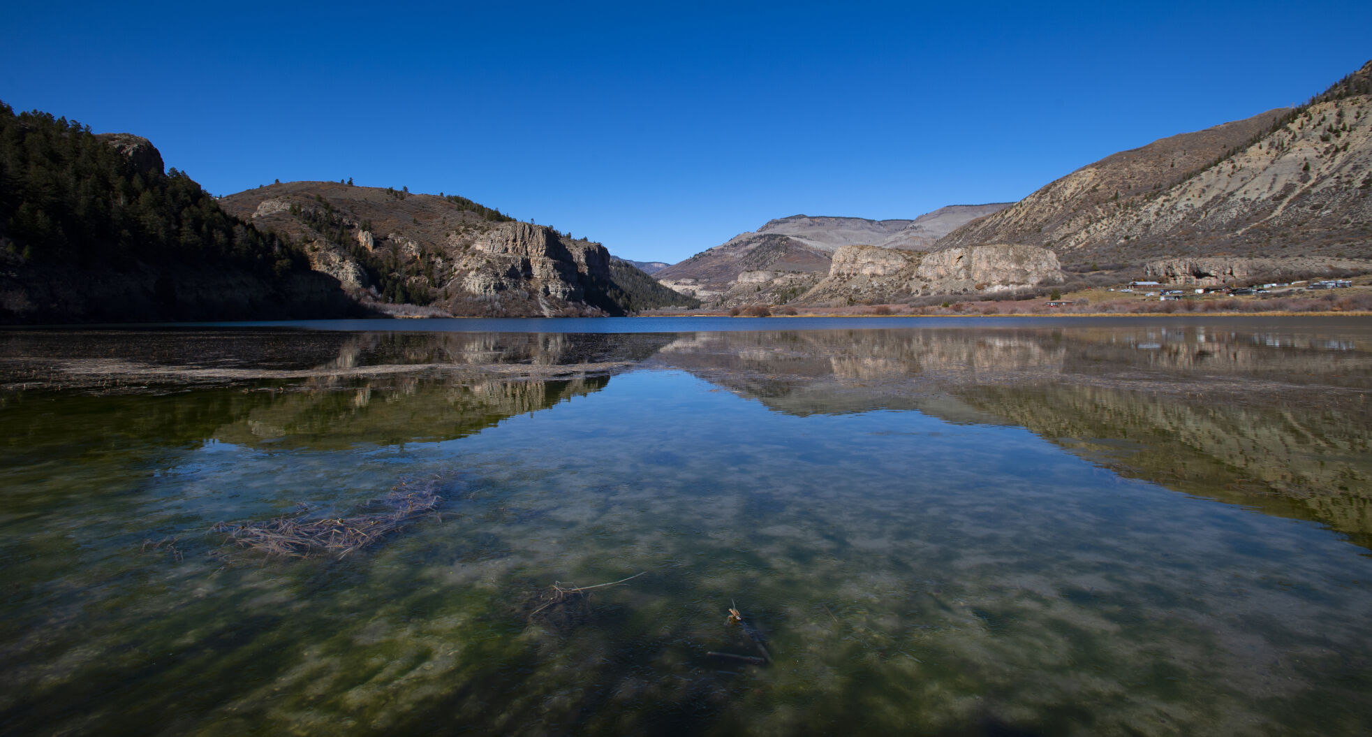 The cliffs surrounding Sweetwater Lake are reflected on the calm waters Thursday, Nov. 4, 2021, with the Flat Top Wilderness Area in the background. (The Gazette, Christian Murdock) (Christian Murdock/The Gazette)